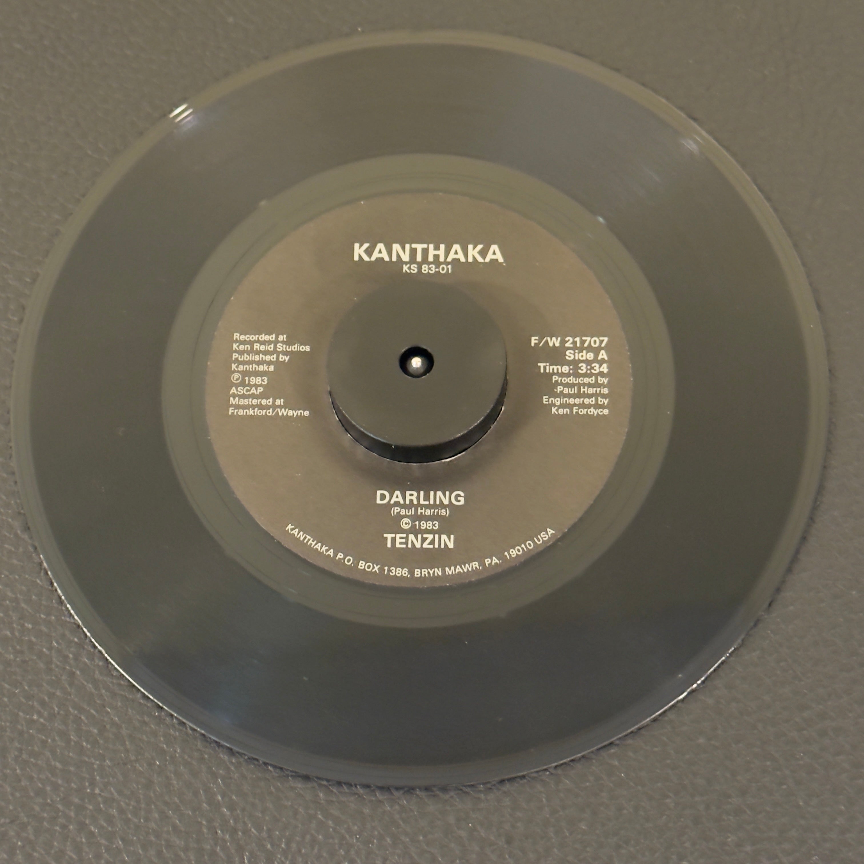 7" vinyl record by Tenzin featuring "Darling/Better Man", released on Kanthaka (F/W 21707), in VG+ (Very Good Plus) condition, classic analog collectable for turntable playback. Impossibly rare 1983 Private Press Country-Rock Americana 45.  A true ghost-rarity, completley unmapped, unrleased to streaming 7" vinyl.