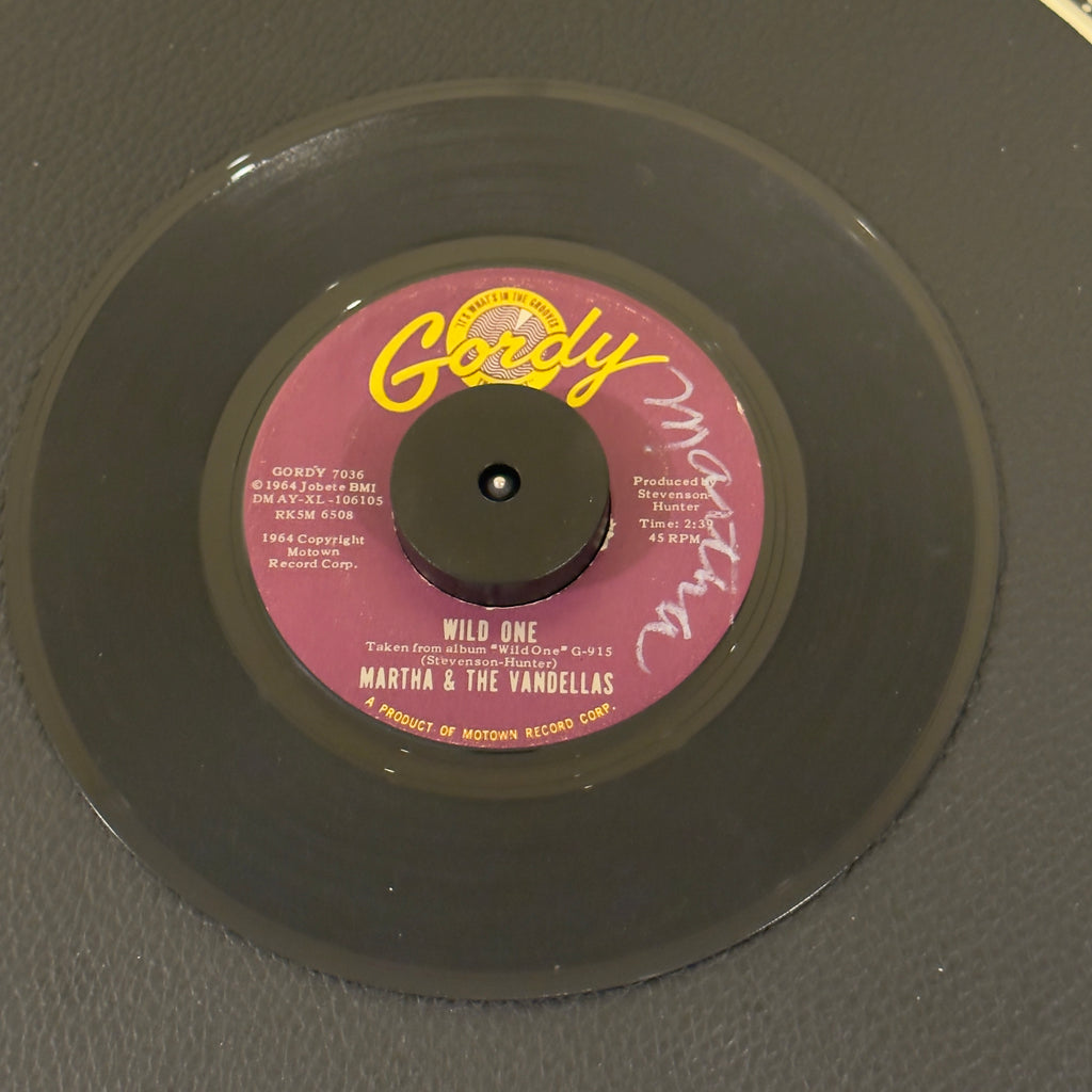 7" vinyl record by Martha & The Vandellas featuring "WIld One/Dancing Slow", released on Gordy (GORDY 7036), in VG (Very Good) condition, classic analog collectable for turntable playback. Writing on both sides of the label.
