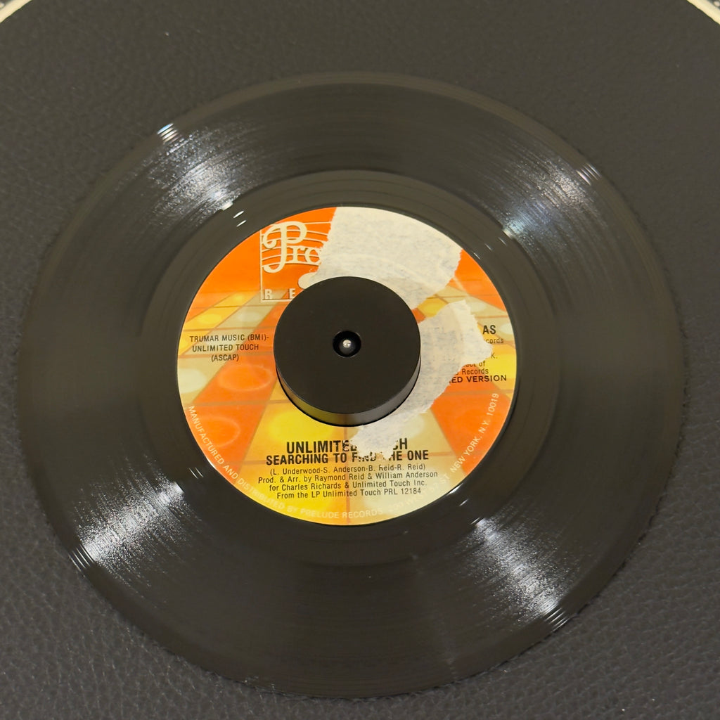 7" vinyl record by Unlimited Touch featuring "Searching To Find The One/Searching To Find The One", released on Prelude Records (PRL8029), in VG+ (Very Good Plus) condition, classic analog collectable for turntable playback. Part of label peeled off (Side A)