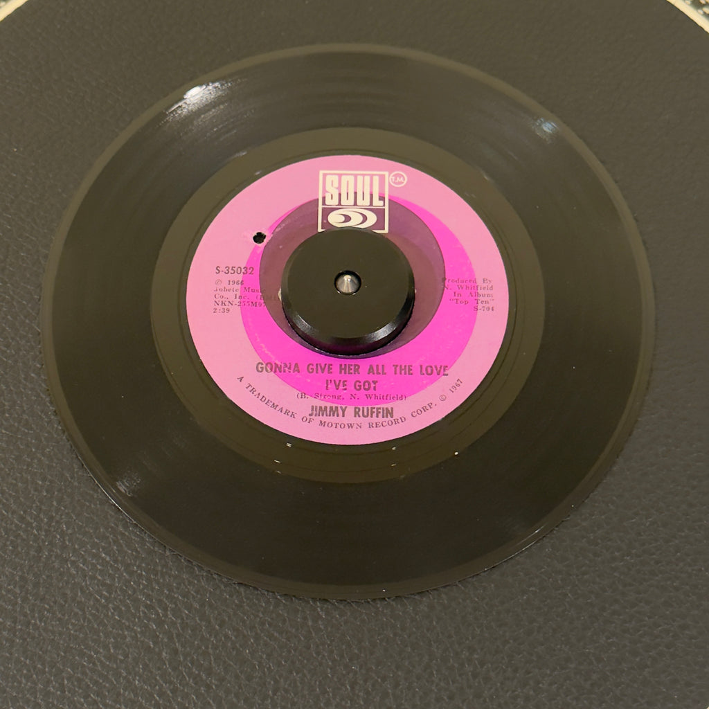 7" vinyl record by Jimmy Ruffin featuring "Gonna Give Her All The Love I've Got/World So Wide, Nowhere To Hide (From Your Heart)", released on Soul (S-35032), in VG+ (Very Good Plus) condition, classic analog collectable for turntable playback. Masterclass in heartbroken, mid-tempo Motown soul.  Label has a BB hole.