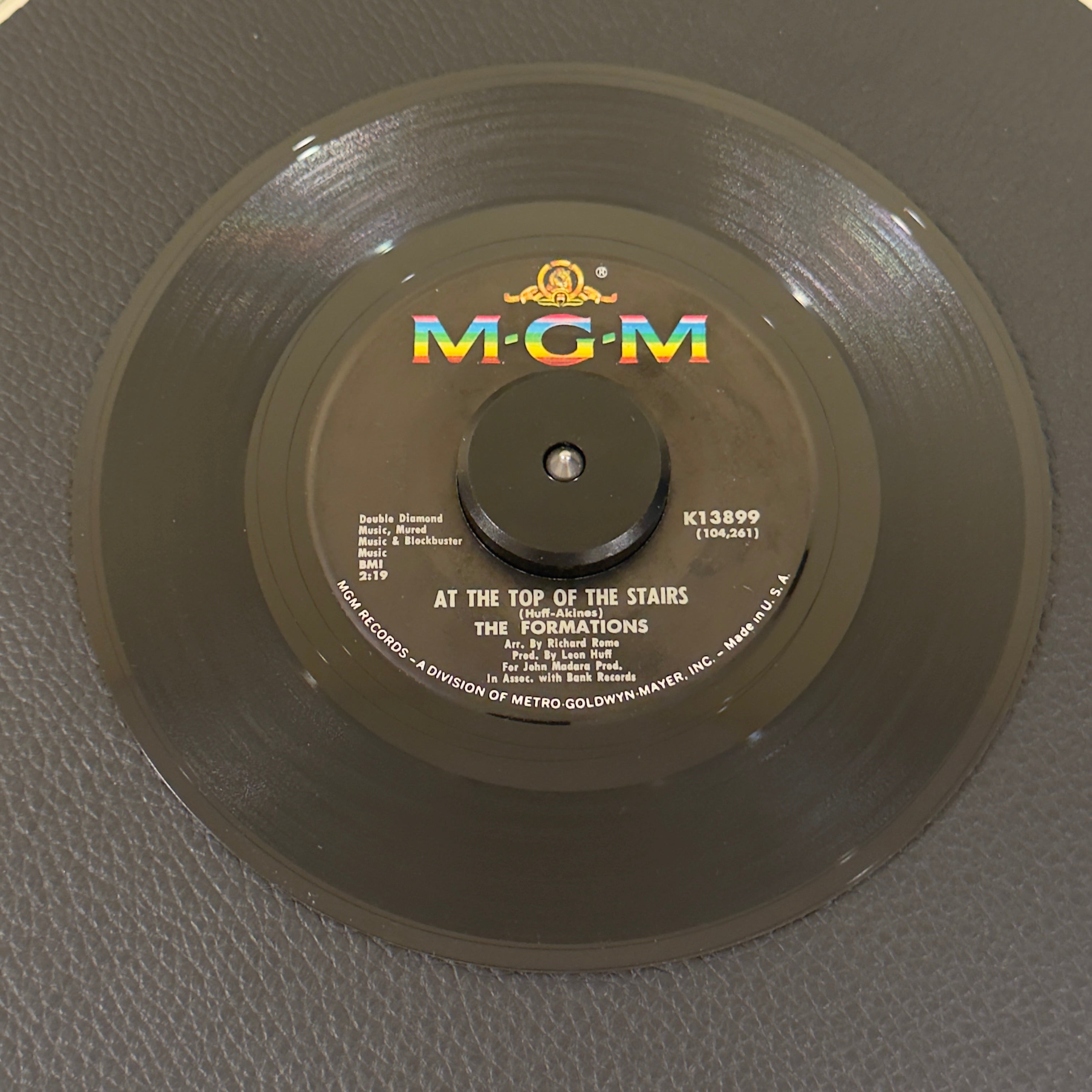 7" vinyl record by Formations, The featuring "At The Top Of The Stairs/Magic Melody", released on MGM Records (K13899), in VG (Very Good) condition, classic analog collectable for turntable playback. Philly Soul masterpiece and an immortal Northern Soul dancefloor burner.