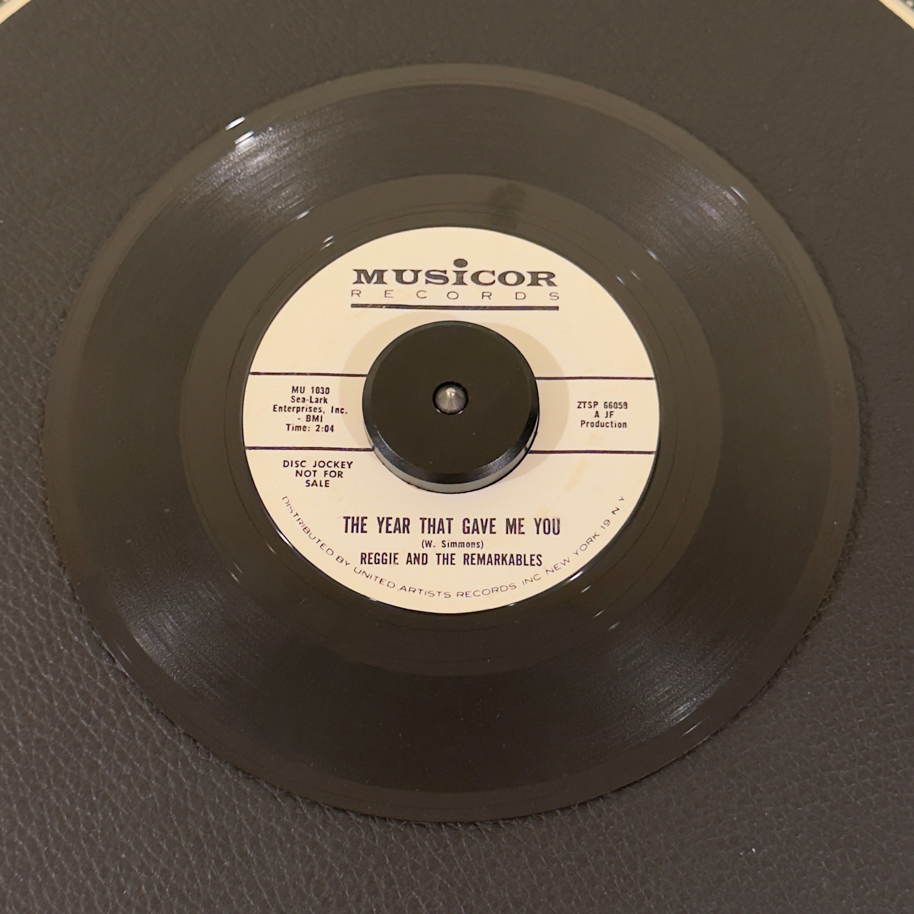 7" vinyl record by Reggie & The Remarkables featuring "The Year That Gave Me You/Come On Baby", released on Musicor Records (MU1030), in VG (Very Good) condition, classic analog collectable for turntable playback. Promo copy of the highly elusive East Coast doo-wop harmony gem in a Musicorp sleeve!