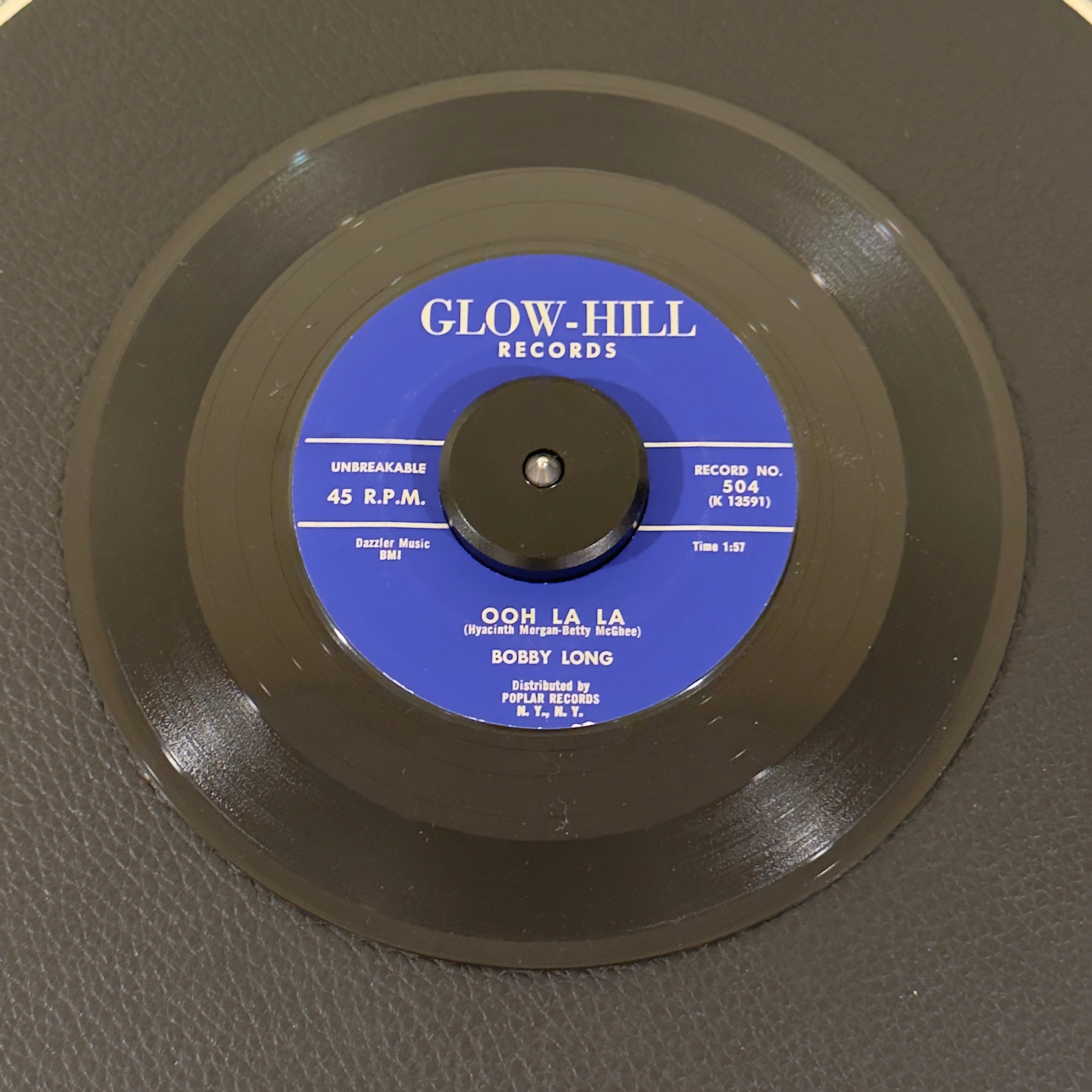 7" vinyl record by Bobby Long featuring "Ooh La La/Hold Me", released on Glow-Hill Records (504), in NM (Near Mint) condition, classic analog collectable for turntable playback. Stunning, archive-worthy copy of Bobby Long's highly sought-after 1959 Doo Wop staple, "Ooh La La".