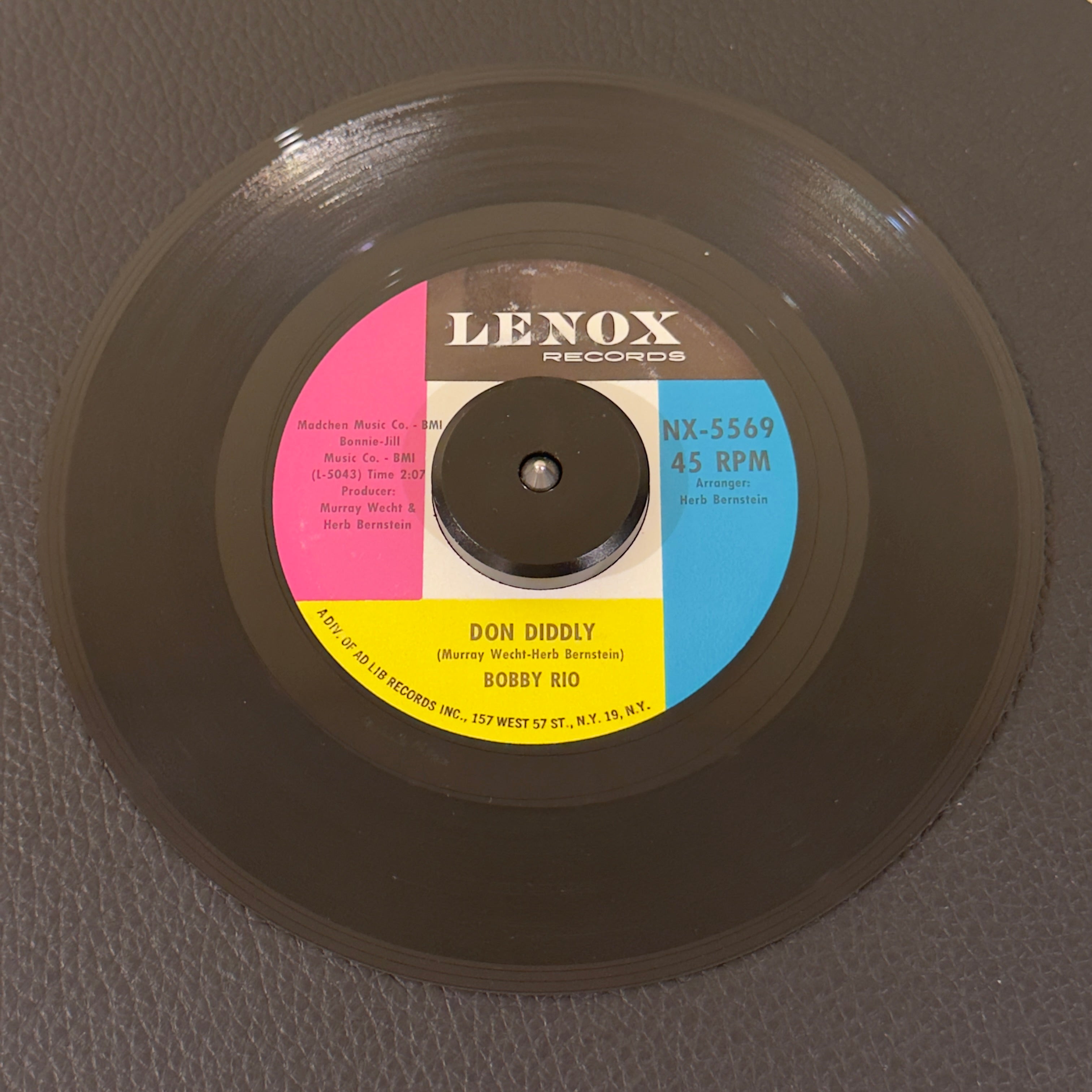 7" vinyl record by Bobby Rio featuring "Don Diddly/I Got You", released on Lenox Records (NX-5569), in VG+ (Very Good Plus) condition, classic analog collectable for turntable playback. 1963 US pressing of a premier teen shaker!