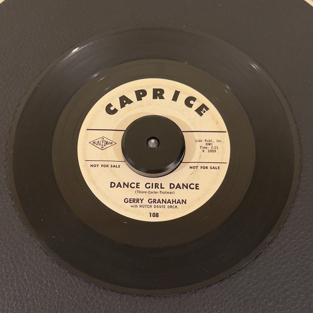 7" vinyl record by Gerry Granahan featuring "Dance Girl Dance/Too Big For Her Bikini", released on Caprice (108), in VG (Very Good) condition, classic analog collectable for turntable playback. 1961 white-label promo pressing of an absolute stellar mid-tempo shaker.