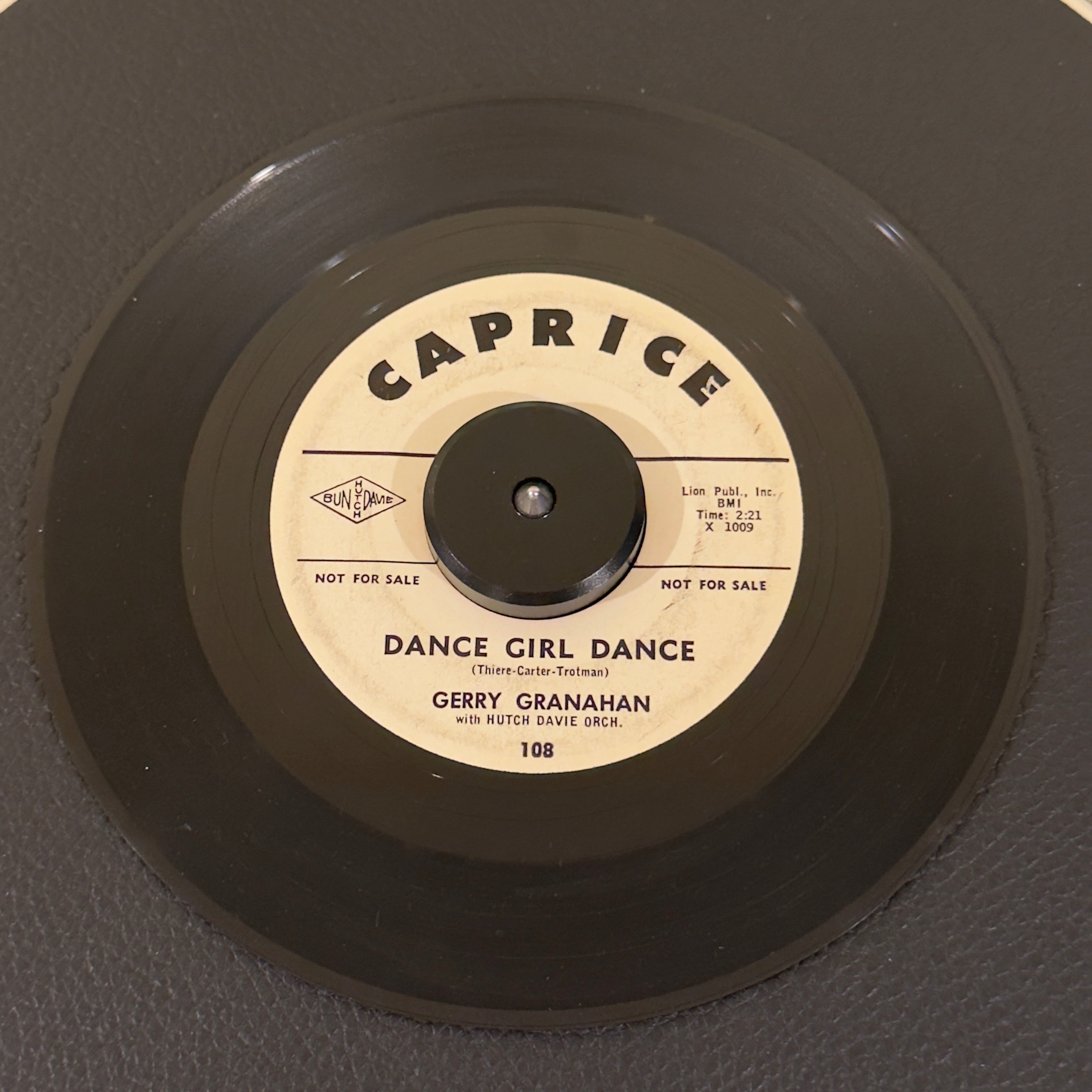 7" vinyl record by Gerry Granahan featuring "Dance Girl Dance/Too Big For Her Bikini", released on Caprice (108), in VG (Very Good) condition, classic analog collectable for turntable playback. 1961 white-label promo pressing of an absolute stellar mid-tempo shaker.