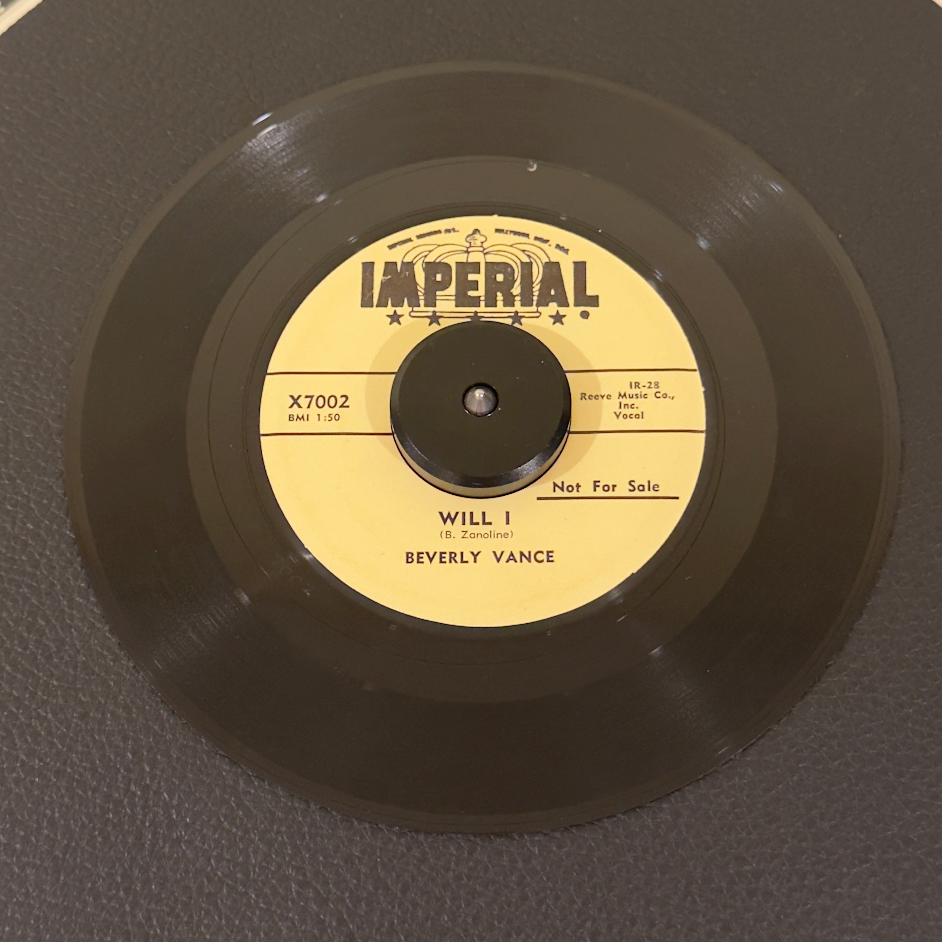 7" vinyl record by Beverly Vance featuring "Will I/In The Chapel", released on Imperial Records (X7002), in VG+ (Very Good Plus) condition, classic analog collectable for turntable playback. Promo copy-time-capsule piece of late-1950s American rockabilly and teen pop history!  Includes original Imperial sleeve.