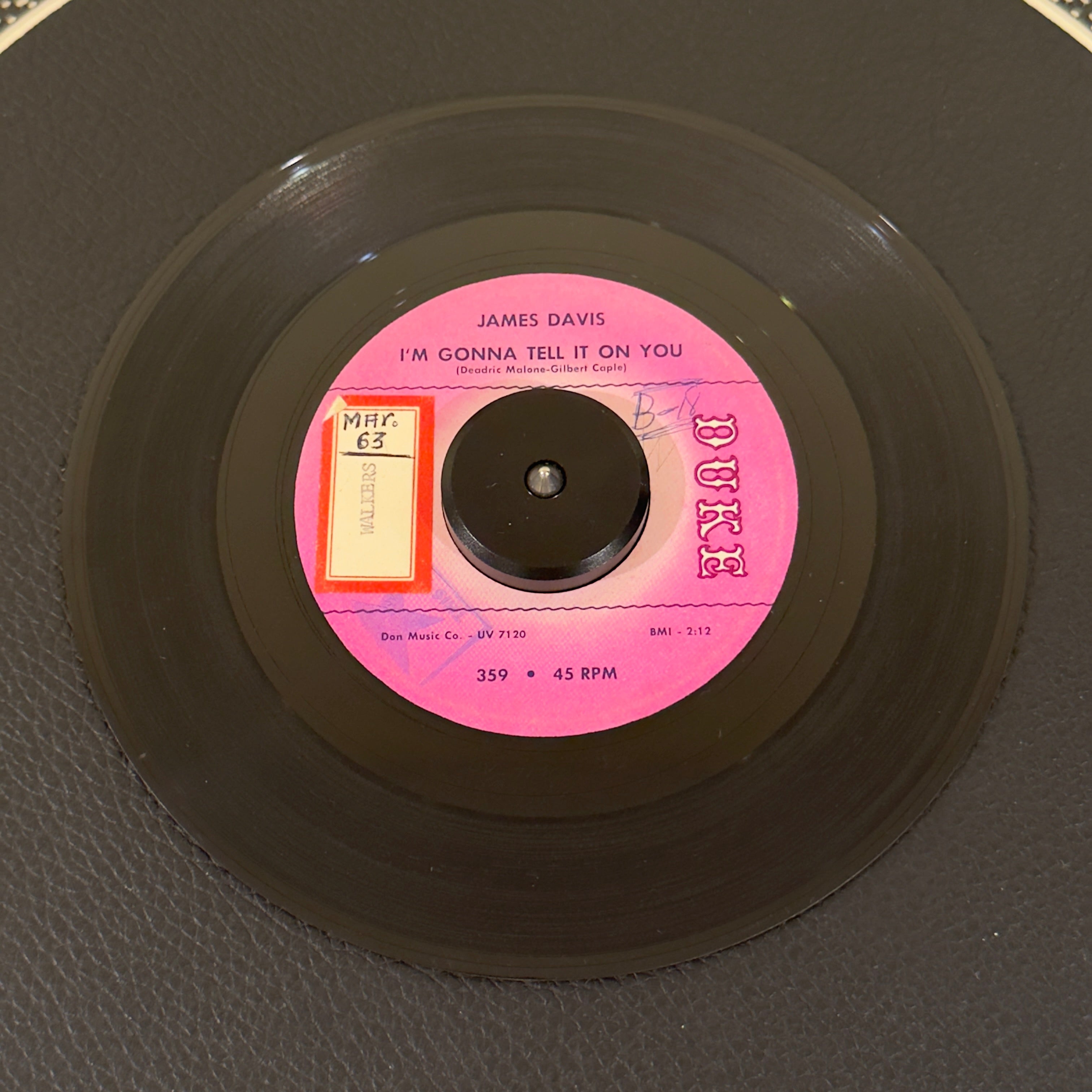 7" vinyl record by James Davis featuring "I'm Gonna Tell It On You/My Precious Darling", released on Duke (359), in VG (Very Good) condition, classic analog collectable for turntable playback. Promo copy powerhouse, blending raw Texas blues shouting with a driving rhythm section.