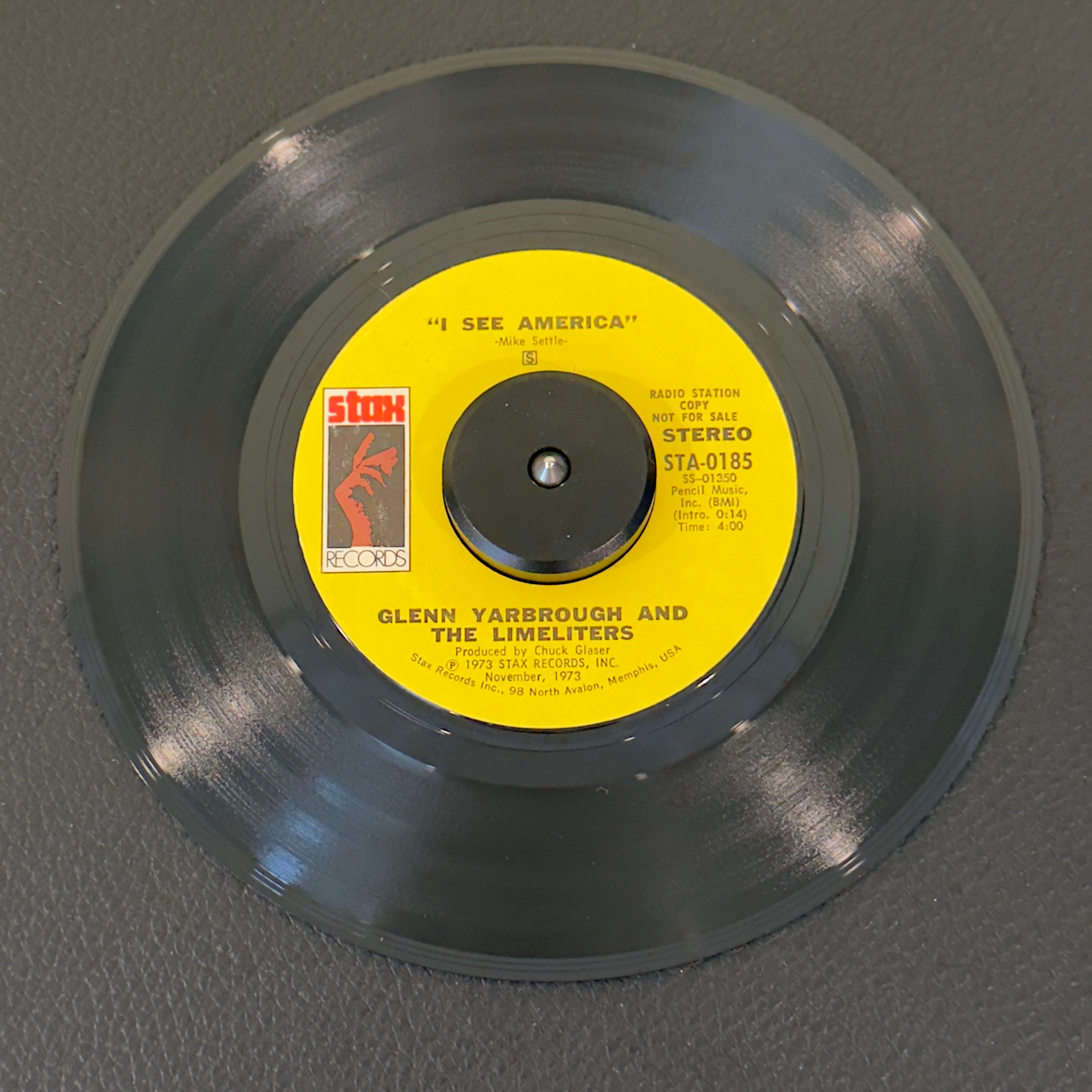 7" vinyl record by Glenn Yarbrough and The Limeliters featuring "I See America", released on Stax (STA-0185), in VG+ (Very Good Plus) condition, classic analog collectable for turntable playback. Promotional Copy! Writing on one side of label.