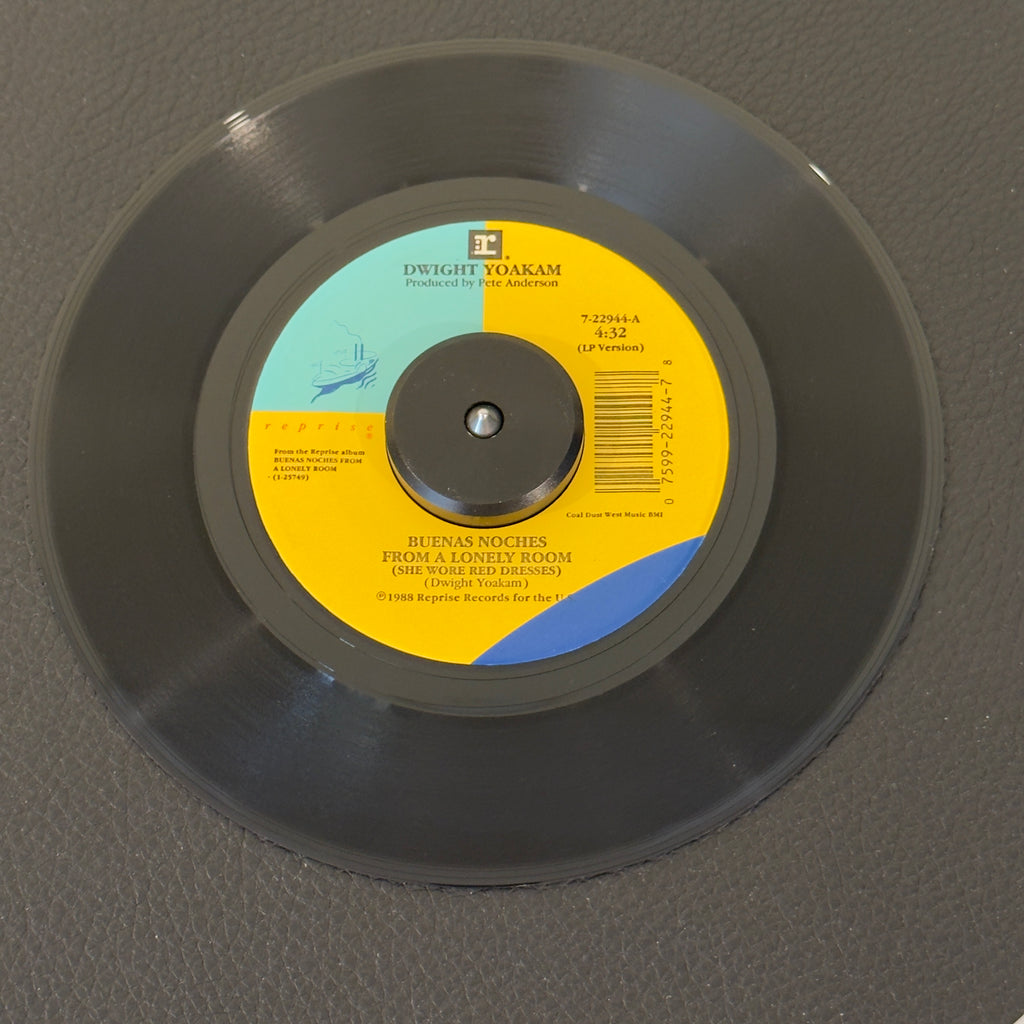 7" vinyl record by Dwight Yoakam featuring "Buenas Noches From A Lonely Room (She Wore Red Dresses)/What I Don't Know", released on Reprise Records (7-22944), in VG+ (Very Good Plus) condition, classic analog collectable for turntable playback. 1989 country banger!