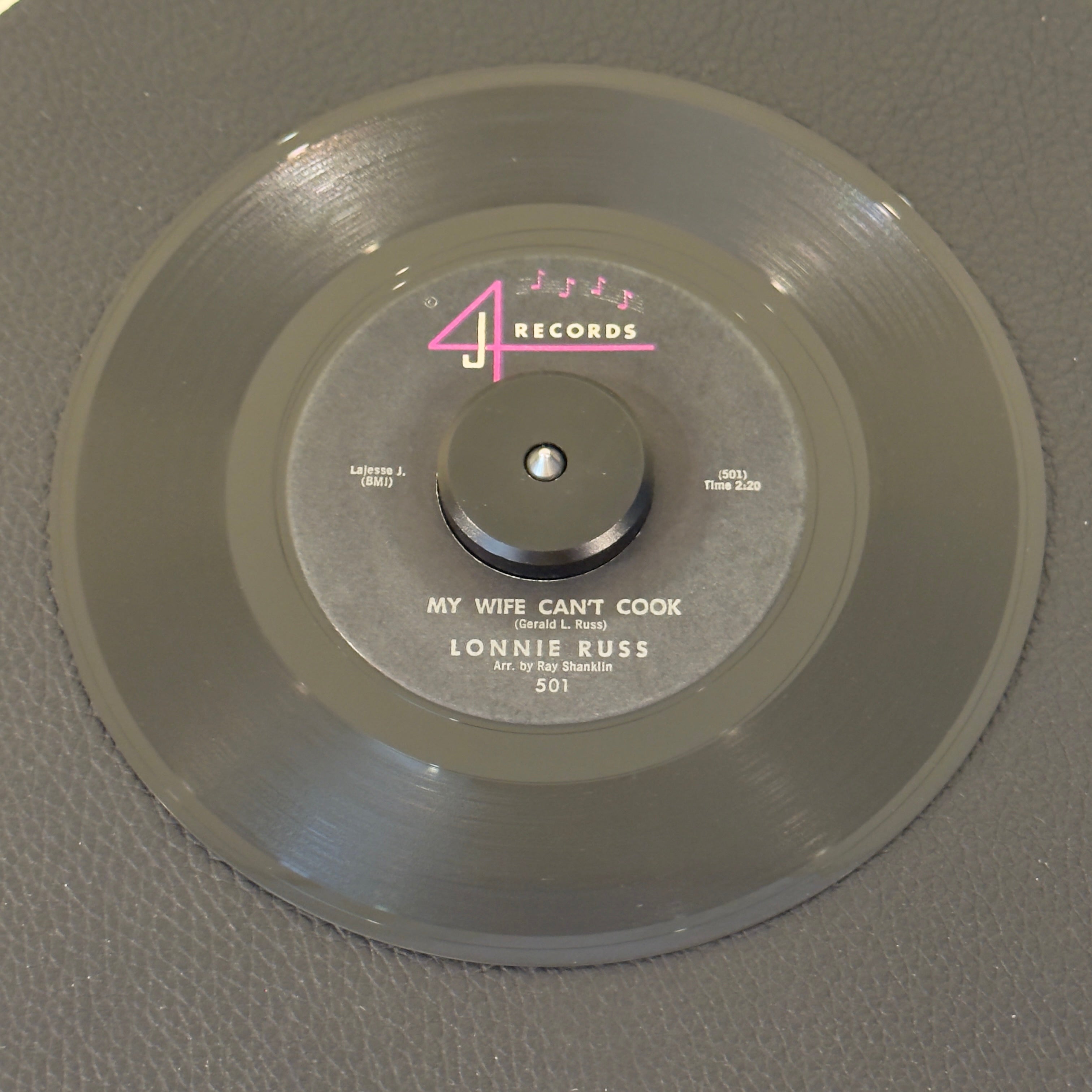 7" vinyl record by Lonnie Russ featuring "My Wife Can't Cook/Something Old, Something New", released on 4 J Records (501), in VG+ (Very Good Plus) condition, classic analog collectable for turntable playback. Original 1962 copy of the rhythm & blues dance floor shaker.