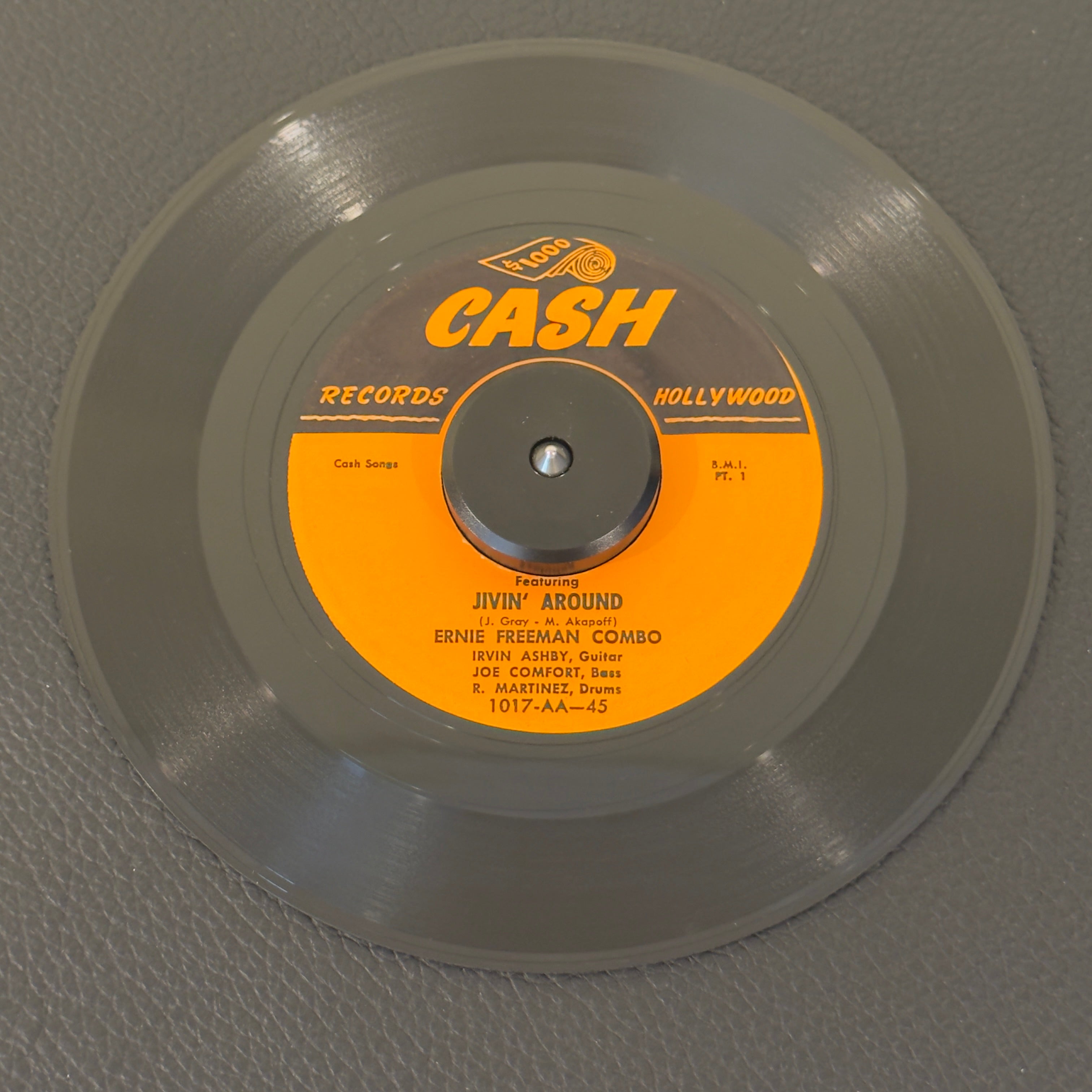 7" vinyl record by Ernie Freeman Combo featuring "Jivin' Around (Pt 1&2)", released on Cash Records (1017), in VG+ (Very Good Plus) condition, classic analog collectable for turntable playback. This track features Freeman's signature driving piano style and a soaring sax hook that made it a massive jukebox favorite across the country.