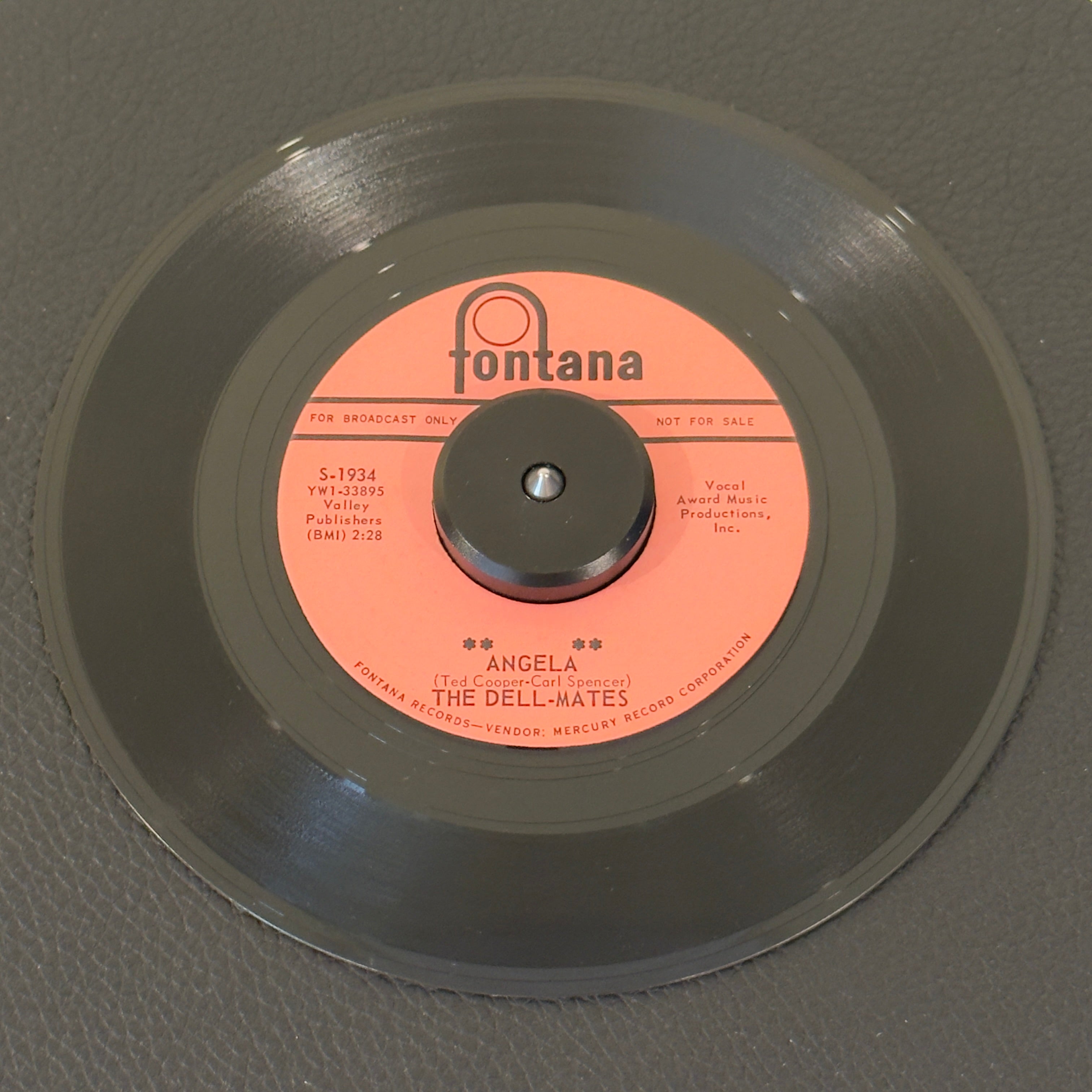 7" vinyl record by Dell-Mates, The featuring "Angela/Cross My Heart And Hope To Die", released on Fontana (S-1934), in VG+ (Very Good Plus) condition, classic analog collectable for turntable playback. Highly regarded on the European "Popcorn" scene, this promo copy features a driving mid-tempo beat and gorgeous undercurrents of late-era doo-wop.  Includes Fontana sleeve.