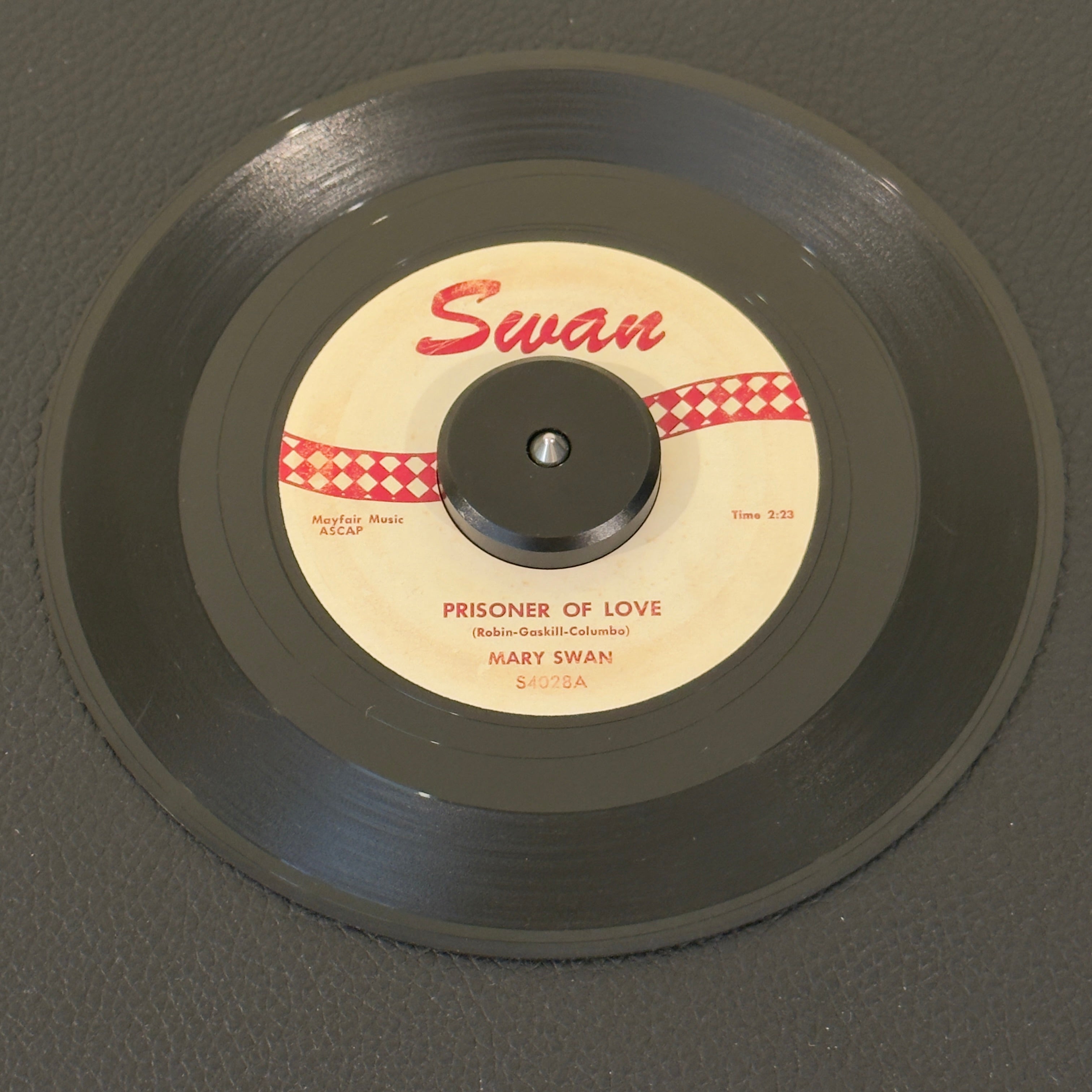 7" vinyl record by Mary Swan featuring "Prisoner Of Love/My Girl Friend Betty", released on Swan (S4028), in VG (Very Good) condition, classic analog collectable for turntable playback. 1959 pop-R&B crossover milestone from Philadelphia's early rock scene.