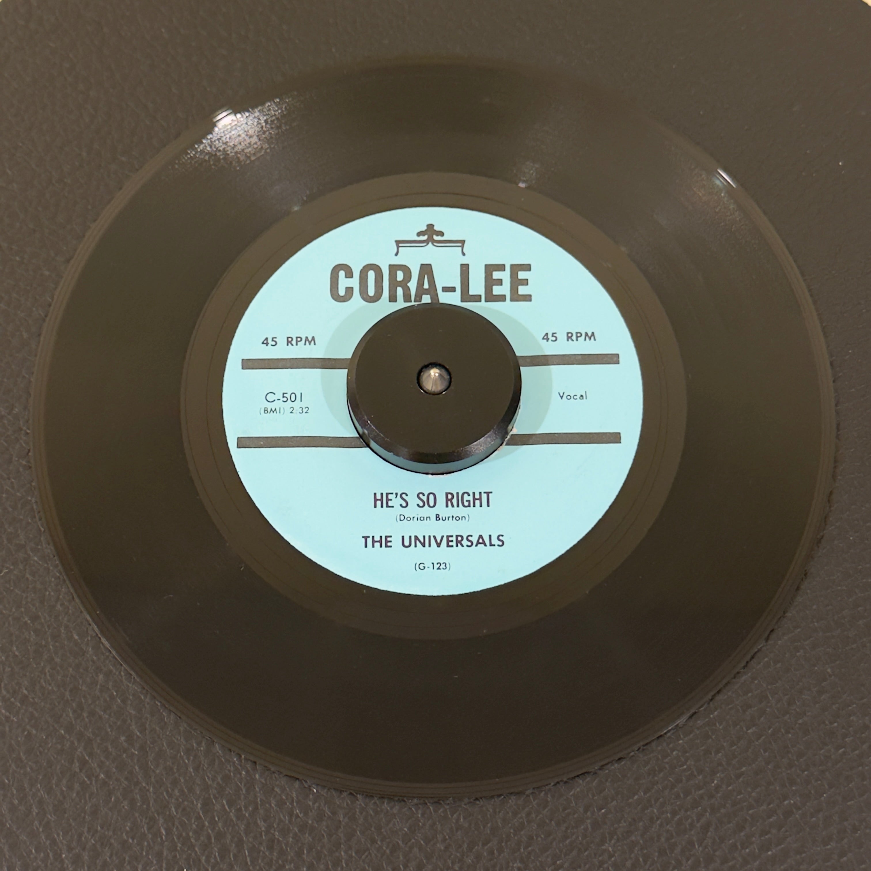 7" vinyl record by Universals, The featuring "He's So Right/The Picture", released on Cora-Lee (C-501), in NM (Near Mint) condition, classic analog collectable for turntable playback. High-quality unofficial release of the timeless East Coast doo-wop double-sider by The Universals.