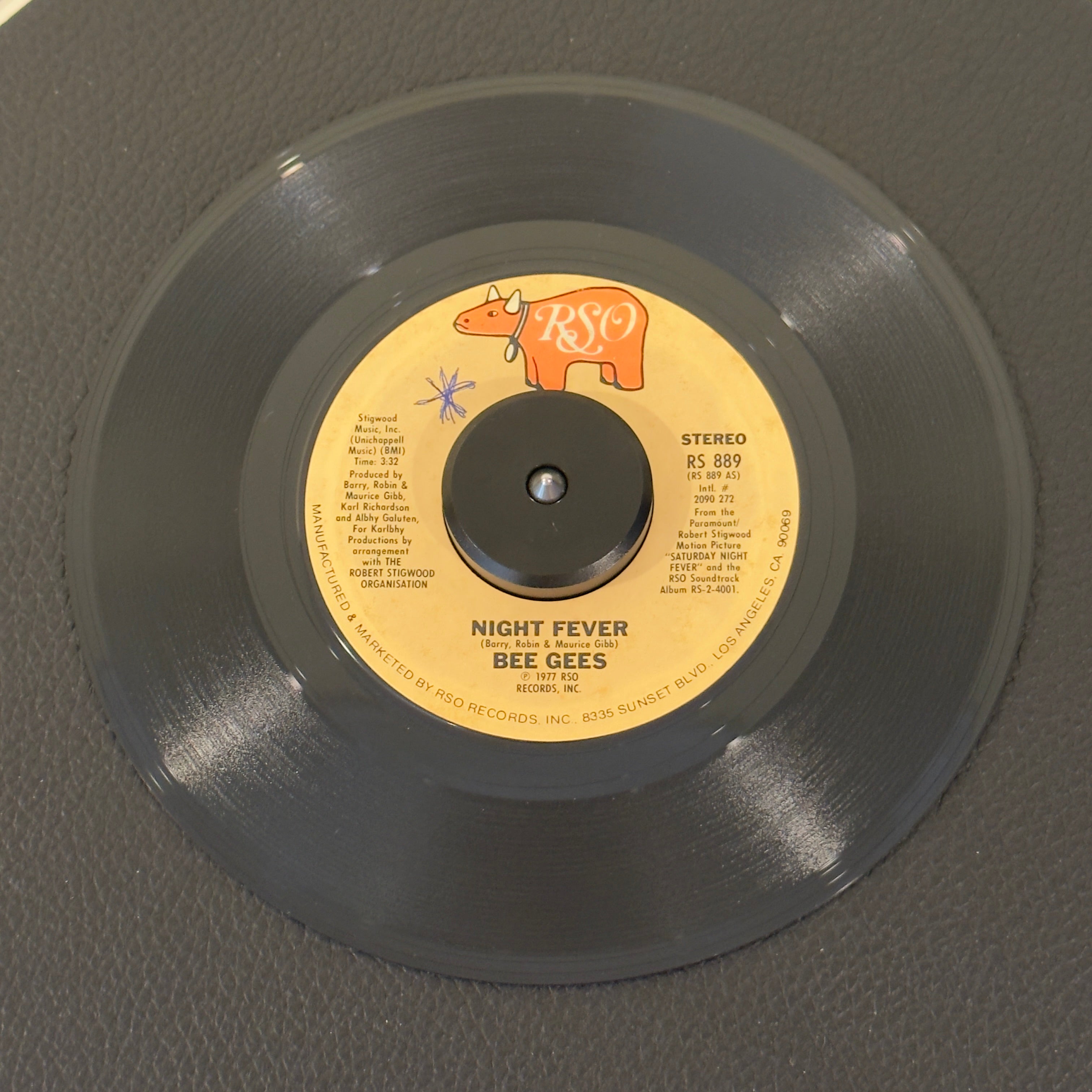 7" vinyl record by Bee Gees featuring "Night Fever/Down The Road", released on RSO (RS 889), in VG+ (Very Good Plus) condition, classic analog collectable for turntable playback. One of the defining disco singles of all time. Taken straight from the monumental Saturday Night Fever movie soundtrack. WOL - Side A.