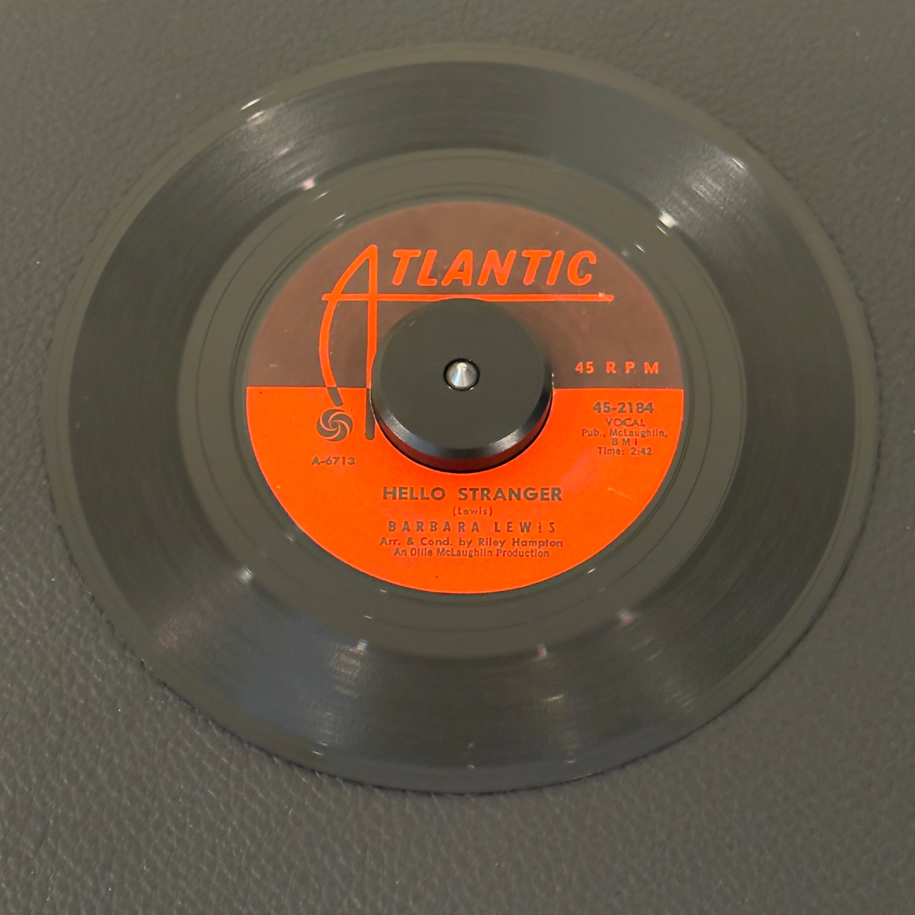 7" vinyl record by Barbara Lewis featuring "Hello Stranger/Think A Little Sugar", released on Atlantic (45-2184), in VG (Very Good) condition, classic analog collectable for turntable playback. 1963 landmark sweet soul classic featuring the smooth, unmistakable backing vocals of The Dells, "Hello Stranger" defines the early '60s Chicago soul sound. Original sleeve included.
