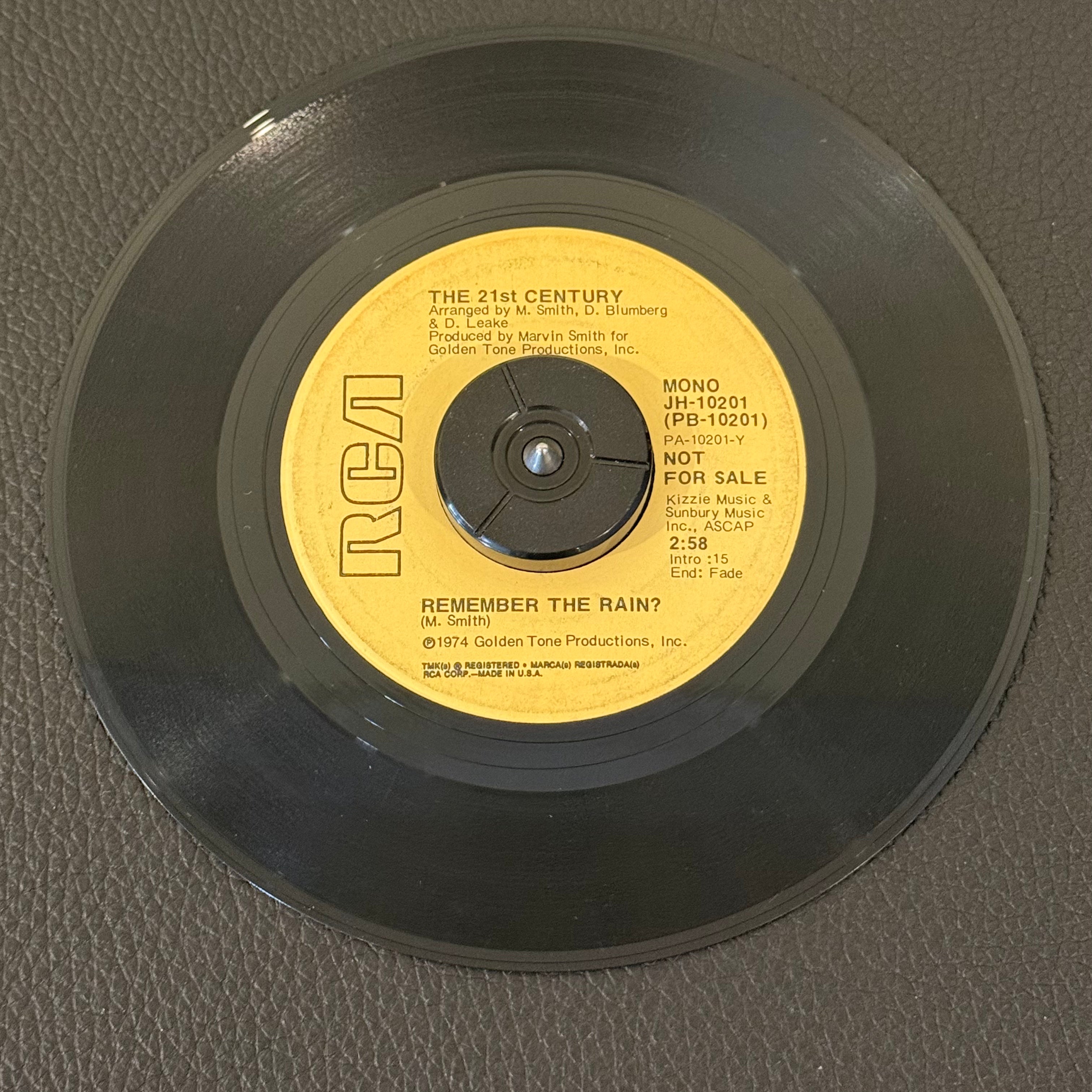 7" vinyl record by 21st Century featuring "Remember The Rain?/Remember The Rain?", released on RCA (JH -10201), in VG (Very Good) condition, classic analog collectable for turntable playback. Includes RCA sleeve. Promo Copy.