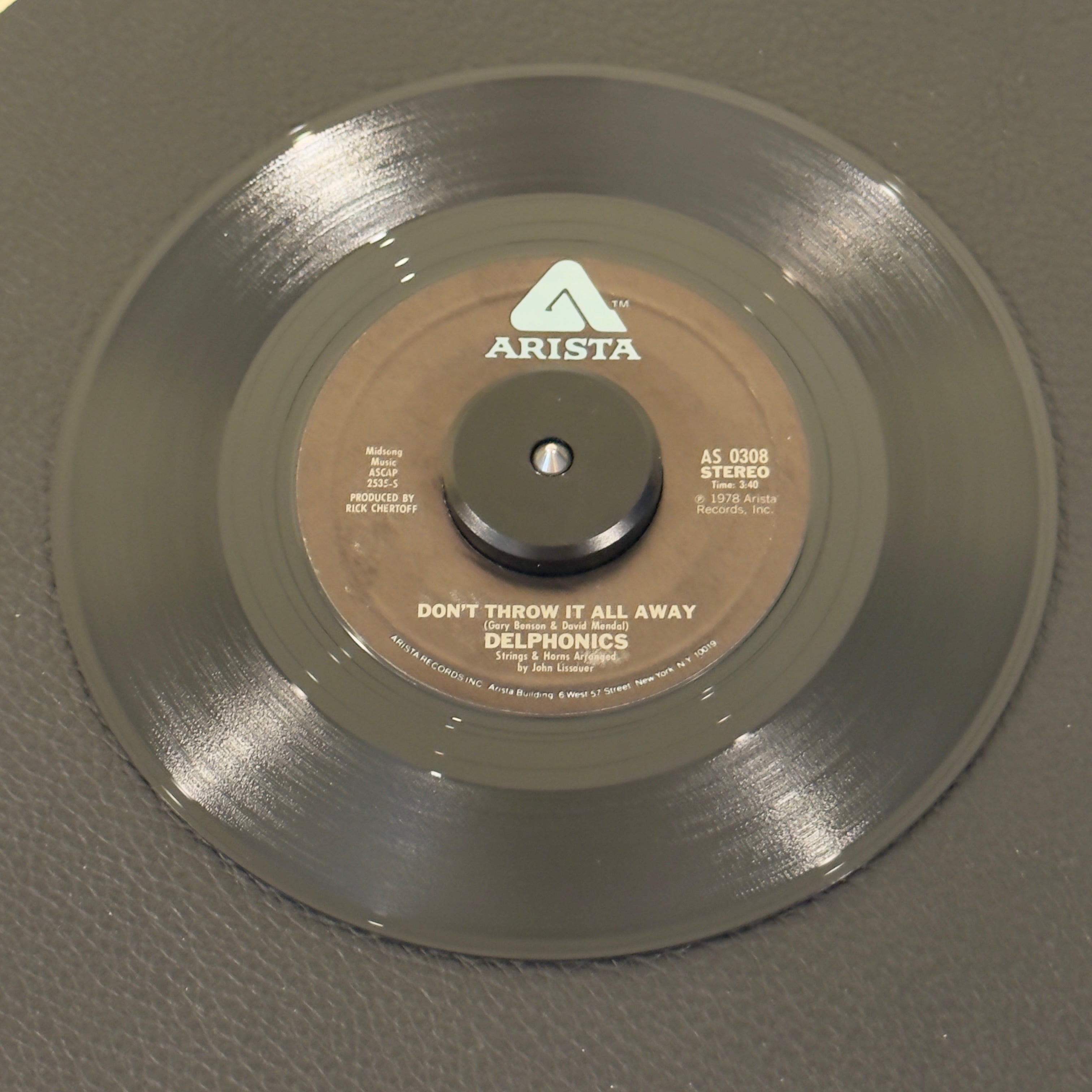 7" vinyl record by Delphonics featuring "Don't Throw It All Away/I Don't Care What People Say", released on Arista (AS 0308), in NM (Near Mint) condition, classic analog collectable for turntable playback. Late-'70s sweet soul masterpiece. Produced by the legendary mid-Atlantic maestro William "Poogie" Hart.  Original Atlantic sleeve.