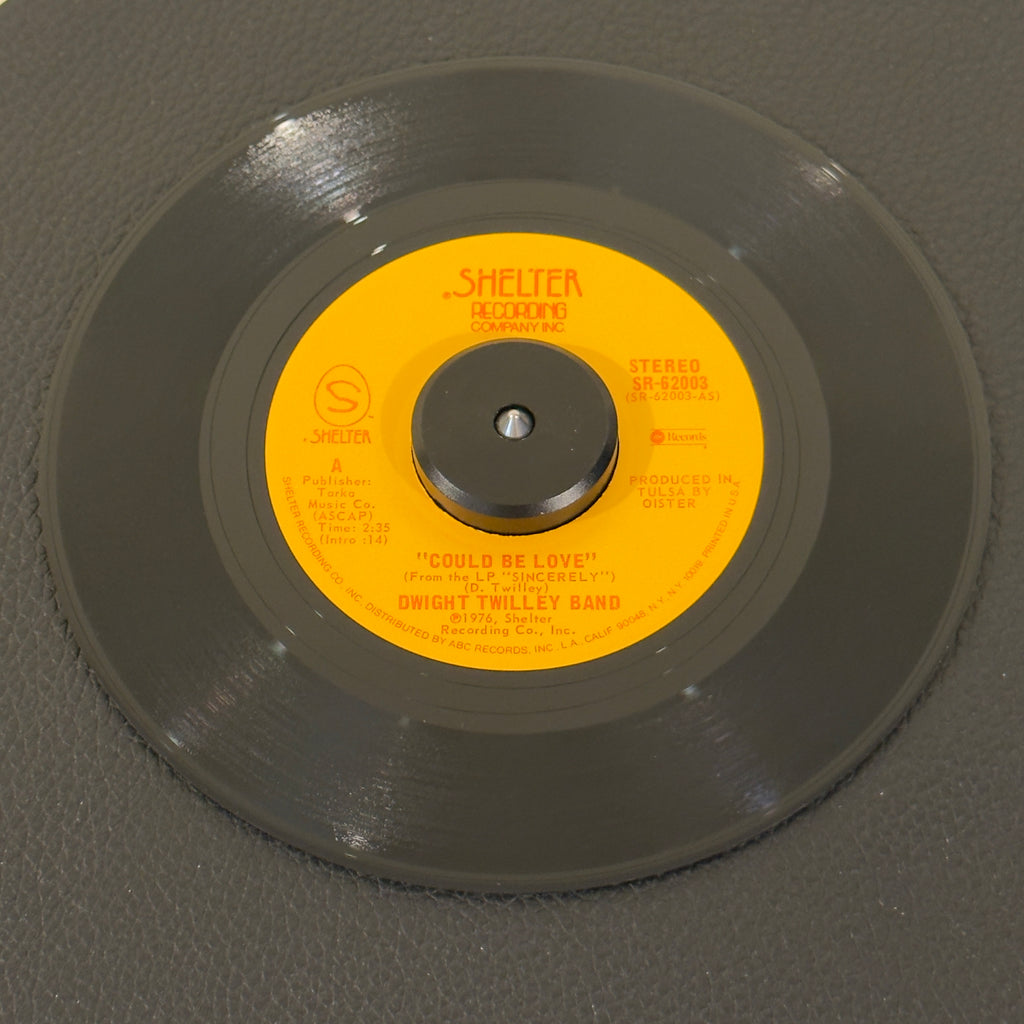 7" vinyl record by Dwight Twilley Band featuring "Could Be Love/Feeling In The Dark", released on Shelter Records (SR-62003), in NM (Near Mint) condition, classic analog collectable for turntable playback. Holy Grail for power-pop purists. Autographed pic sleeve included! Signed by Dwight Twilley and Phil Seymour.