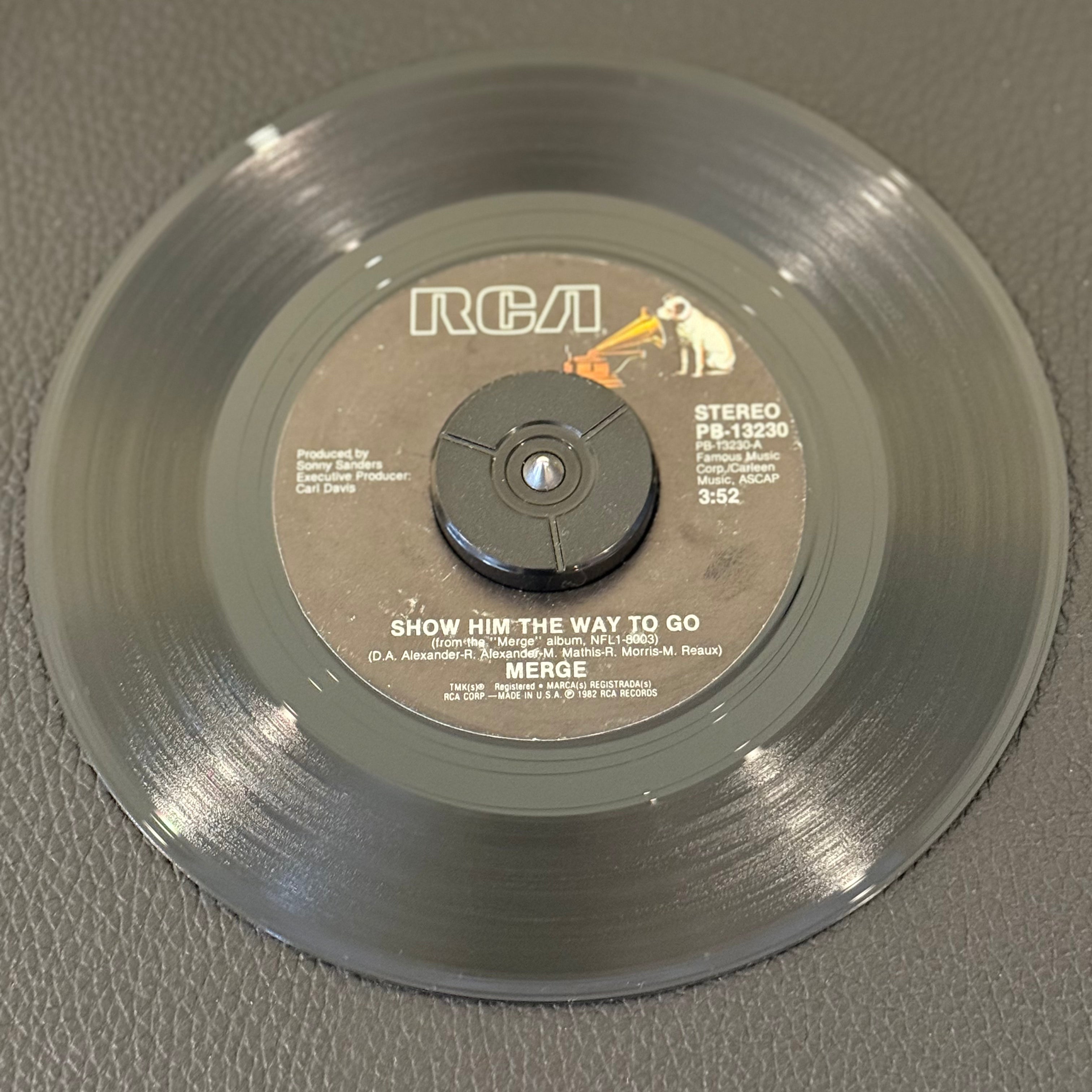7" vinyl record by Merge featuring "Show Him The Way To Go/Heavenly", released on RCA (PB -13230), in VG+ (Very Good Plus) condition, classic analog collectable for turntable playback. Includes RCA sleeve.