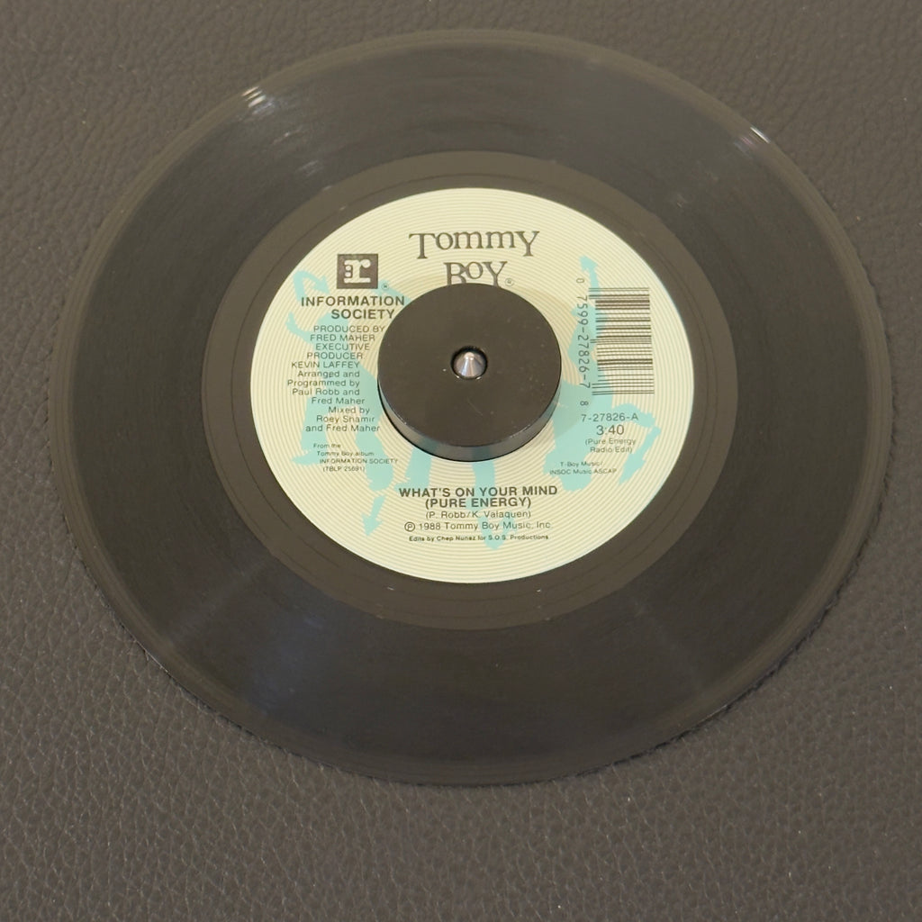 7" vinyl record by Information Society featuring "What's On Your Mind (Pure Energy) (Pure Energy Radio Edit)/(Club Radio Edit)", released on Tommy Boy (7-27826), in VG+ (Very Good Plus) condition, classic analog collectable for turntable playback. Defining synth-pop anthem of the late-80s club scene. Famously featuring vocal samples of Leonard Nimoy's Spock from Star Trek. Pic Sleeve.