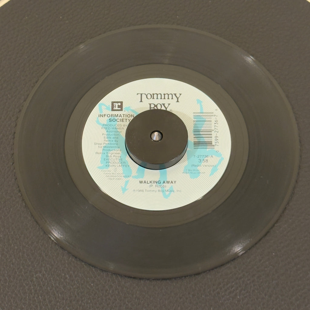 7" vinyl record by Information Society featuring "Walking Away (Radio Version)/Make It Funkier (Extended Version)", released on Tommy Boy (7-27736), in VG (Very Good) condition, classic analog collectable for turntable playback. Pic sleeve included.
