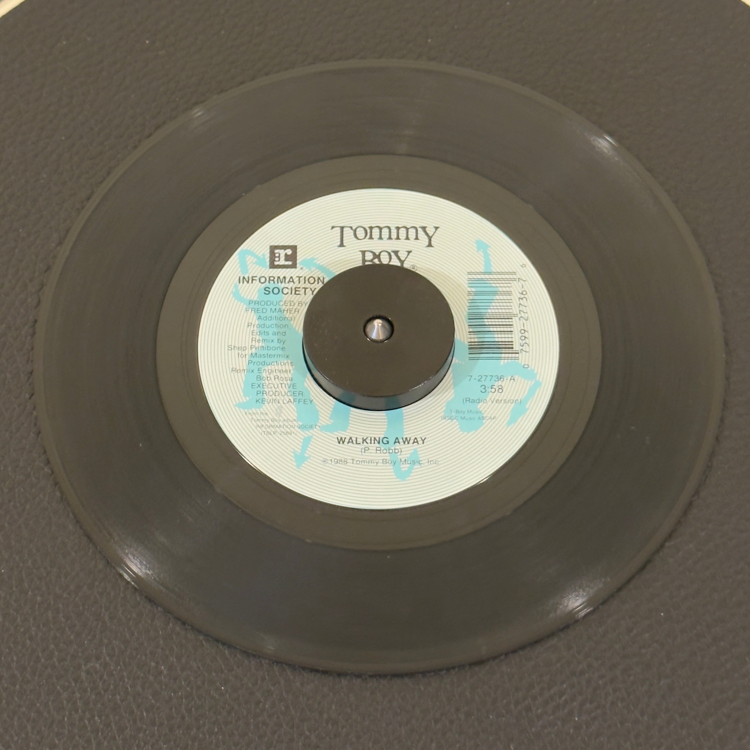 7" vinyl record by Information Society featuring "Walking Away (Radio Version)/Make It Funkier (Extended Version)", released on Tommy Boy (7-27736), in VG (Very Good) condition, classic analog collectable for turntable playback. Pic sleeve included.