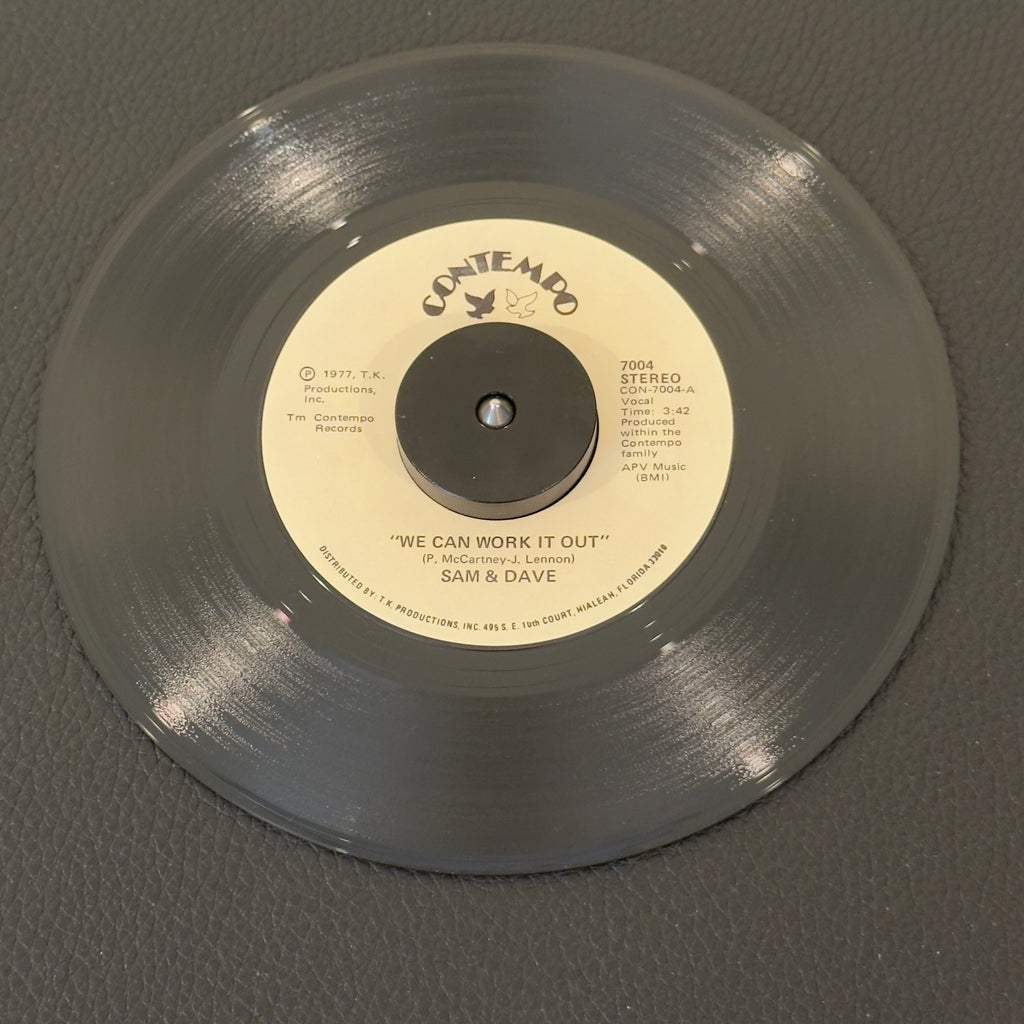 7" vinyl record by Sam & Dave featuring "We Can Work It Out/Why Did You Do It", released on Contempo (7004), in NM (Near Mint) condition, classic analog collectable for turntable playback.