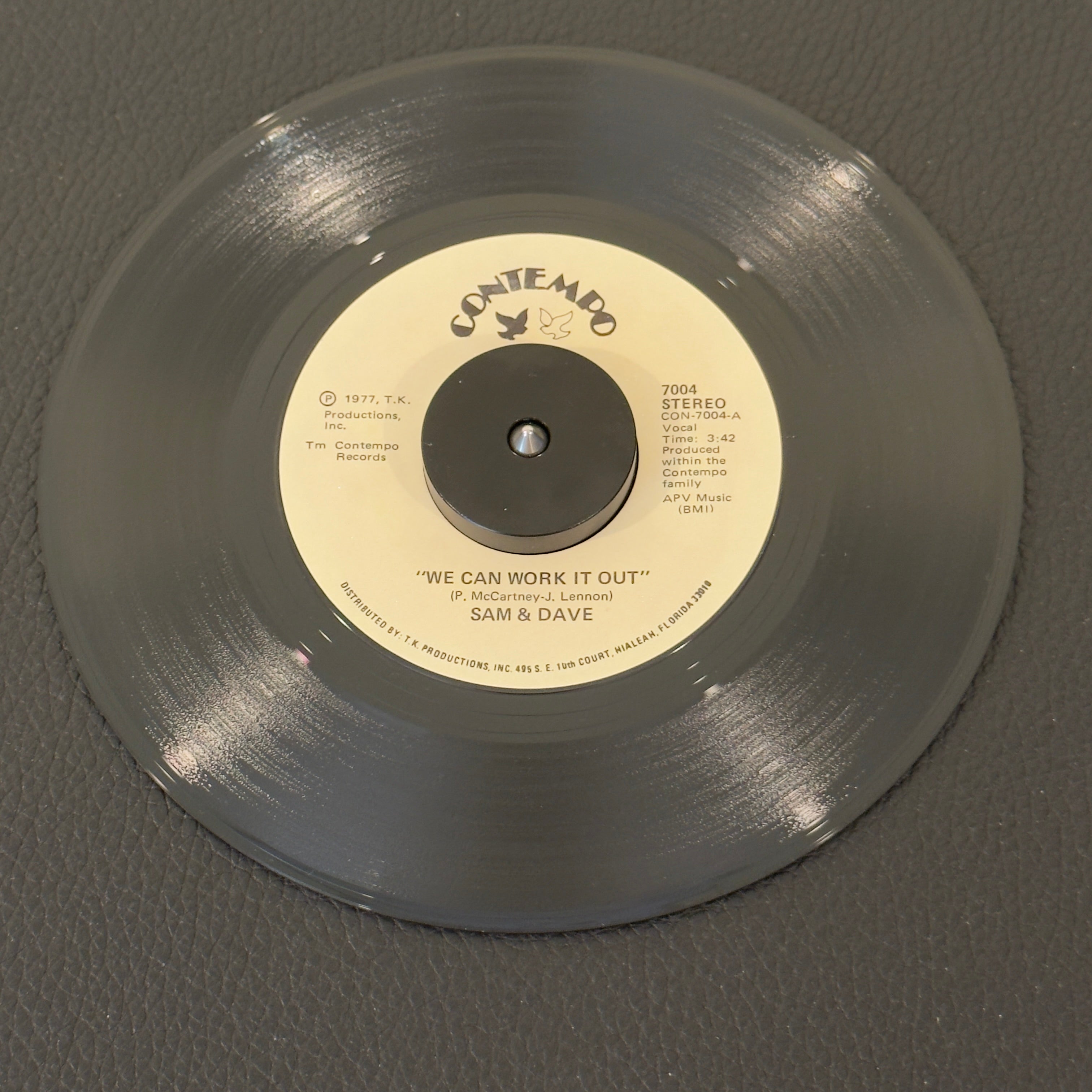 7" vinyl record by Sam & Dave featuring "We Can Work It Out/Why Did You Do It", released on Contempo (7004), in NM (Near Mint) condition, classic analog collectable for turntable playback.