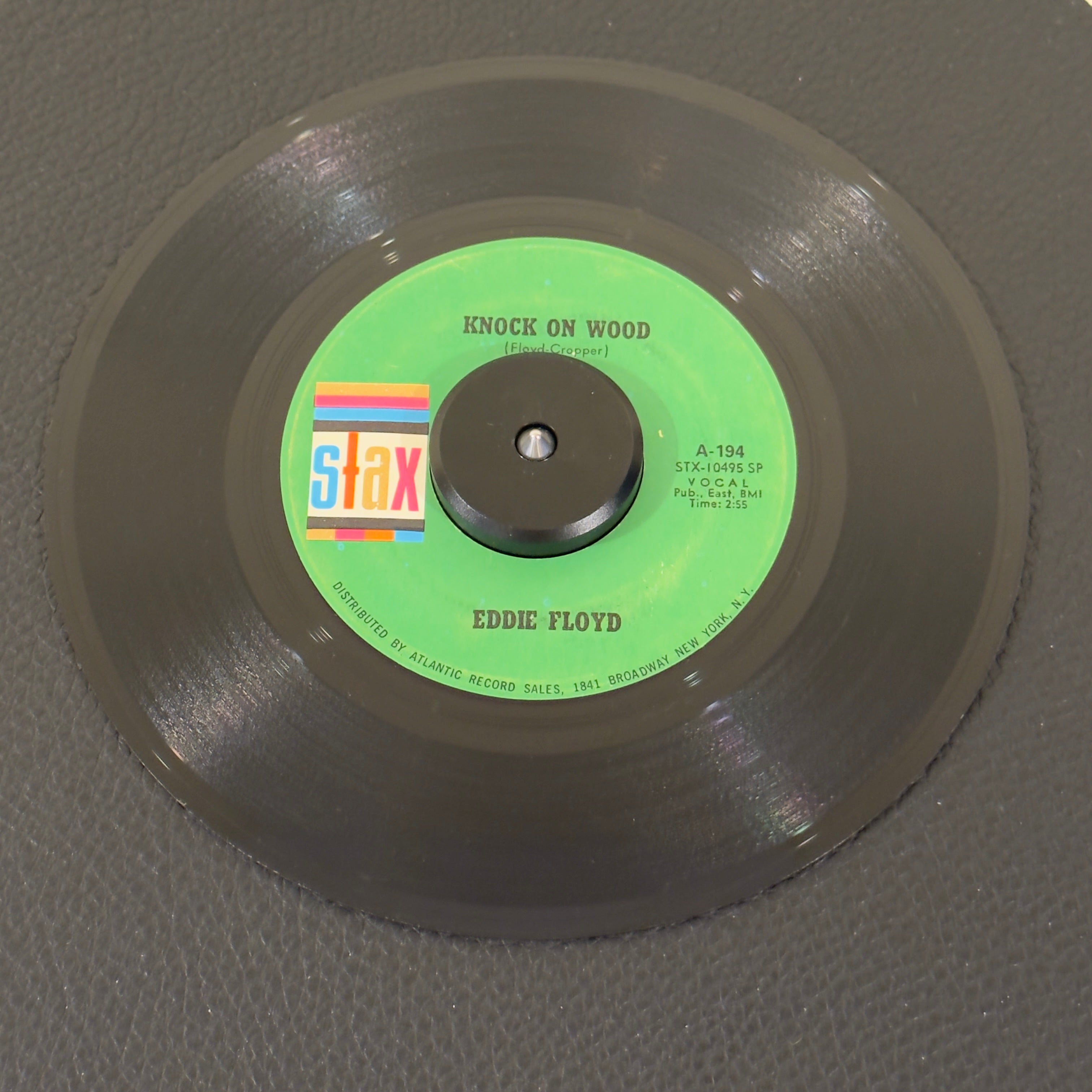 7" vinyl record by Eddie Floyd featuring "Knock On Wood/Got To Make A Comeback", released on Stax (A-194), in VG (Very Good) condition, classic analog collectable for turntable playback. 1968 US reissue pressing of Eddie Floyd’s legendary anthem "Knock On Wood" is a classic slice of Memphis soul history!