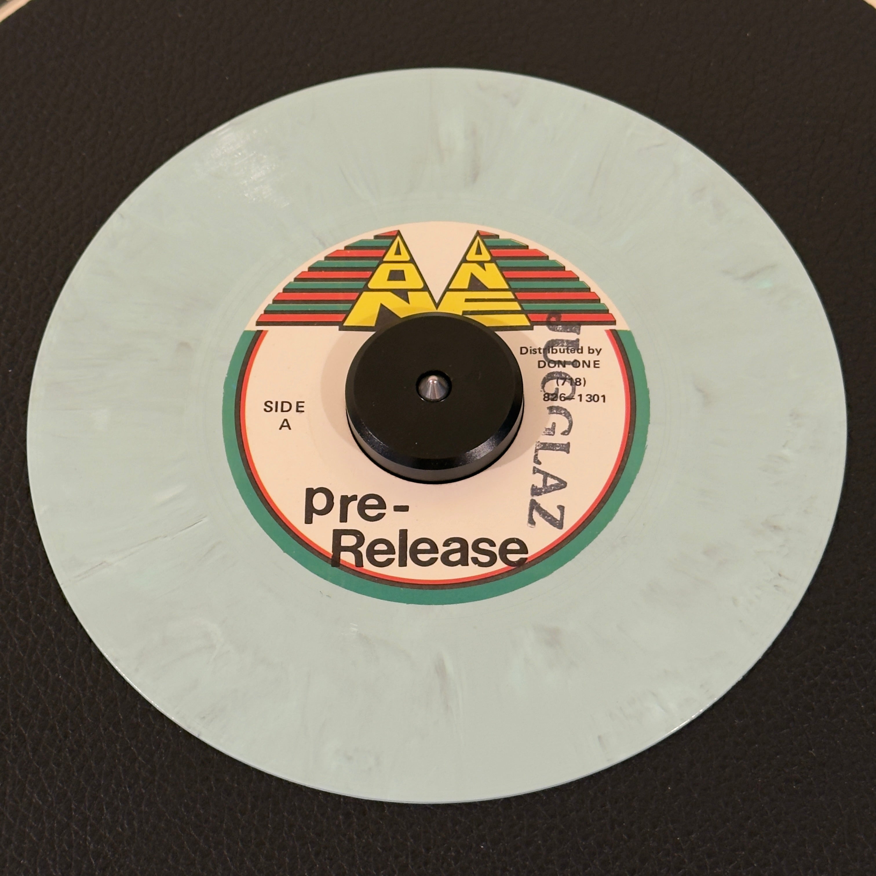 7" vinyl record by Ian Sweetness featuring "Said And Done/Instrumental", released on Don One (), in VG+ (Very Good Plus) condition, classic analog collectable for turntable playback. Ultra-limited Pre-Release Pressing of a 1990s piece of Brooklyn reggae history, pressed on a beautiful, factory-customized marble splatter colored vinyl. DJ Stamp on Side A.
