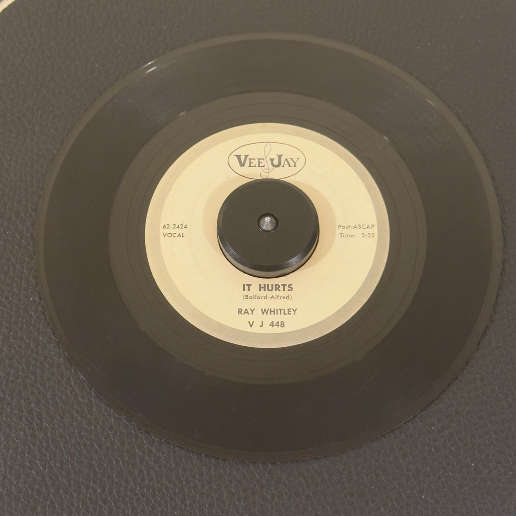 7" vinyl record by Ray Whitley featuring "It Hurts/Deeper In Love", released on Vee Jay Records (VJ 448), in VG (Very Good) condition, classic analog collectable for turntable playback. White Label Promotional copy of Whitley’s classic.