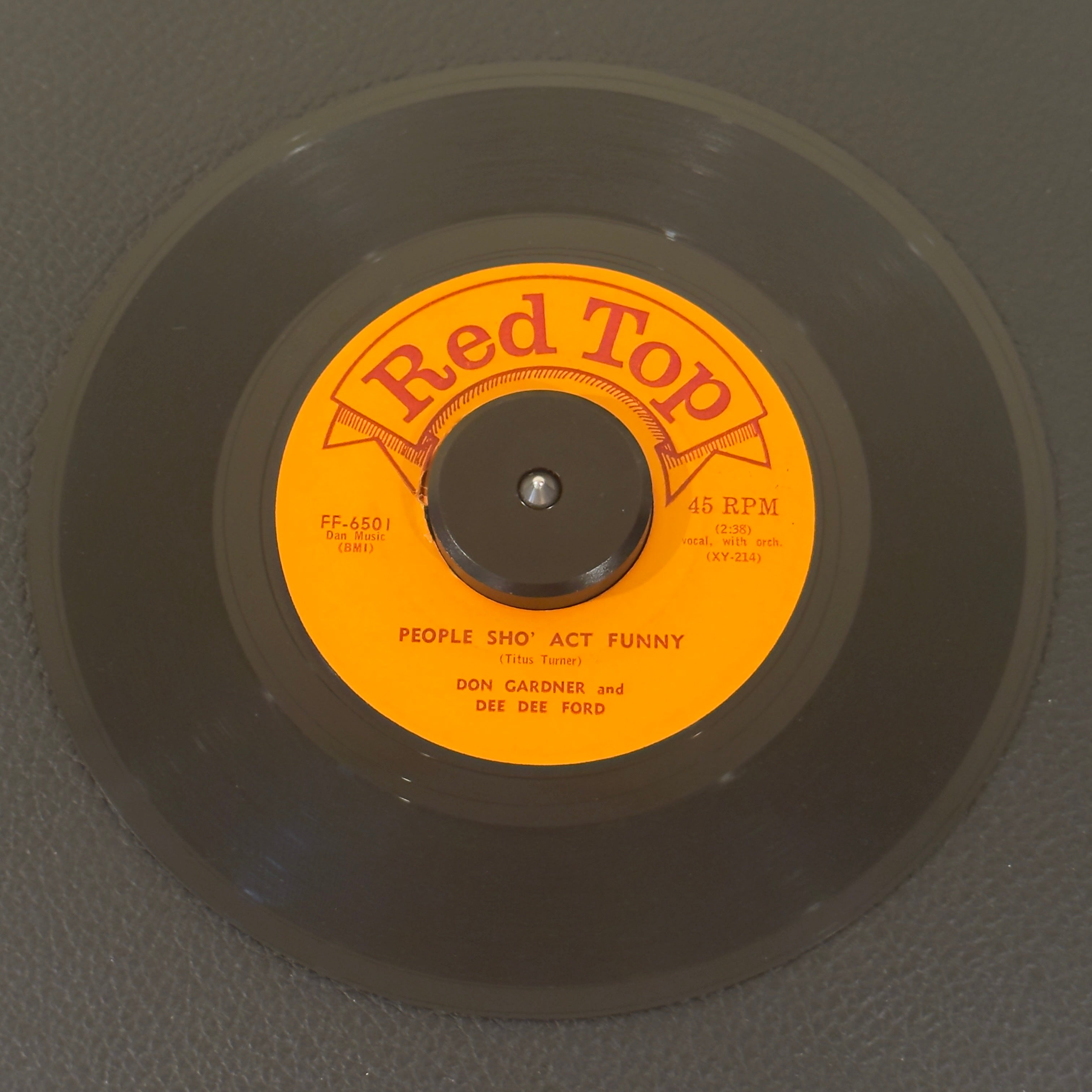 7" vinyl record by Don Gardner & Dee Dee Ford featuring "People Sho' Act Funny/Shake A Leg, Baby", released on Red Top (FF-6501), in VG (Very Good) condition, classic analog collectable for turntable playback. Original 1963 single featuring the high-octane Mod R&B double-sider by the legendary duo Don Gardner & Dee Dee Ford.