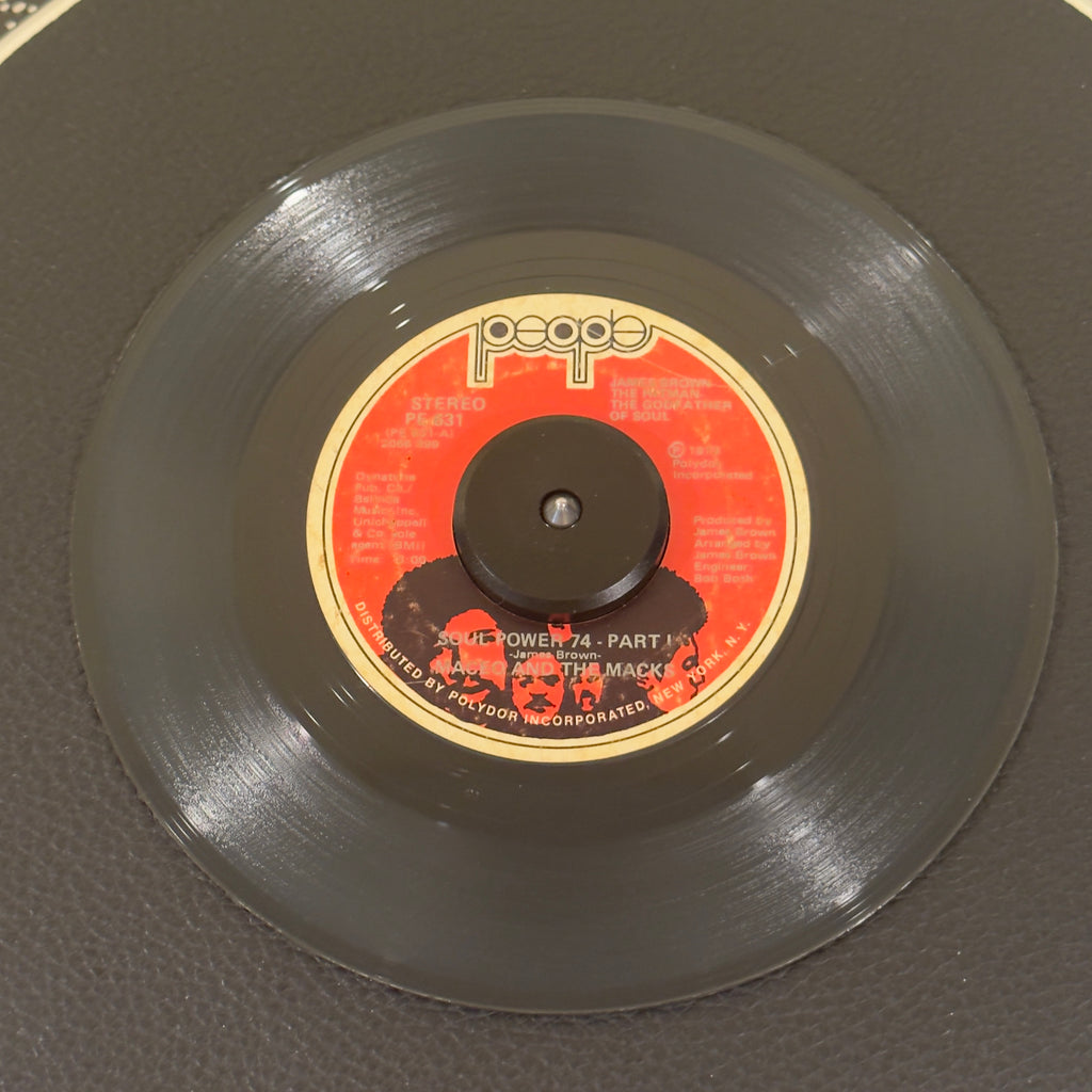 7" vinyl record by Maceo And The Macks featuring "Soul Power 74 - Part I/Part II", released on People (PE 631), in VG (Very Good) condition, classic analog collectable for turntable playback. Original 1973 first pressing of the essential funk double-sider features the highly desirable original red label layout.