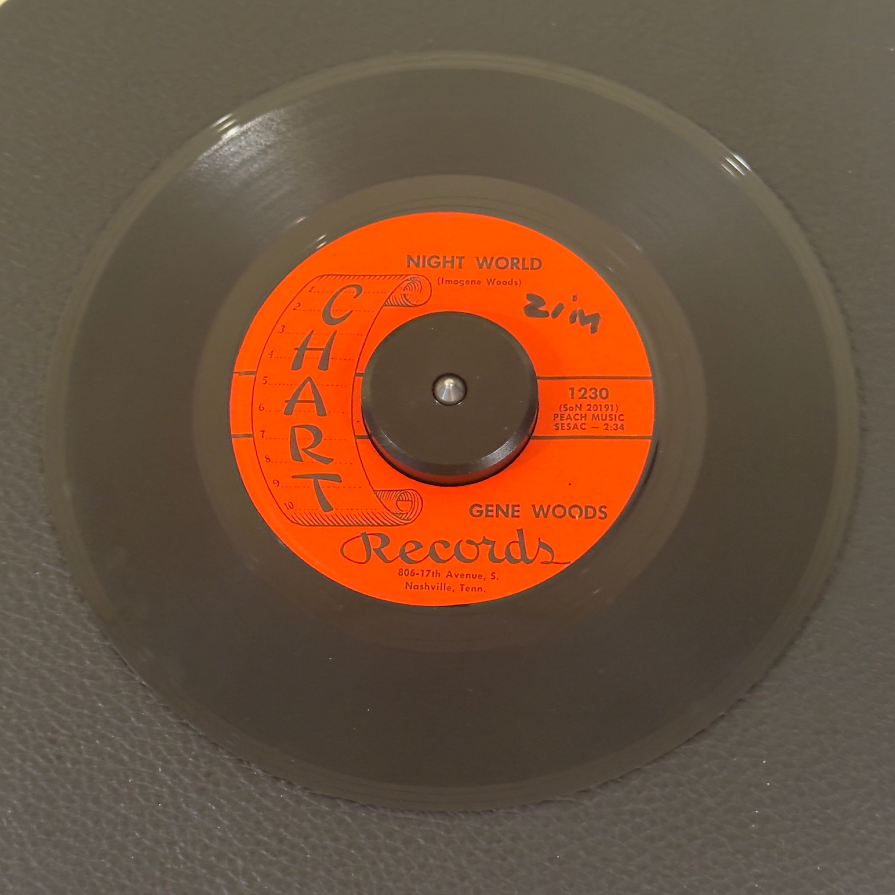 7" vinyl record by Gene Woods featuring "Night World/As I Walk Alone", released on Chart Records (1230), in VG+ (Very Good Plus) condition, classic analog collectable for turntable playback. Released on the highly collectible independent Nashville imprint Chart Records, this single is a stellar slice of mid-60s honky tonk and classic country history.  Orig Chart Sleeve included. WOL