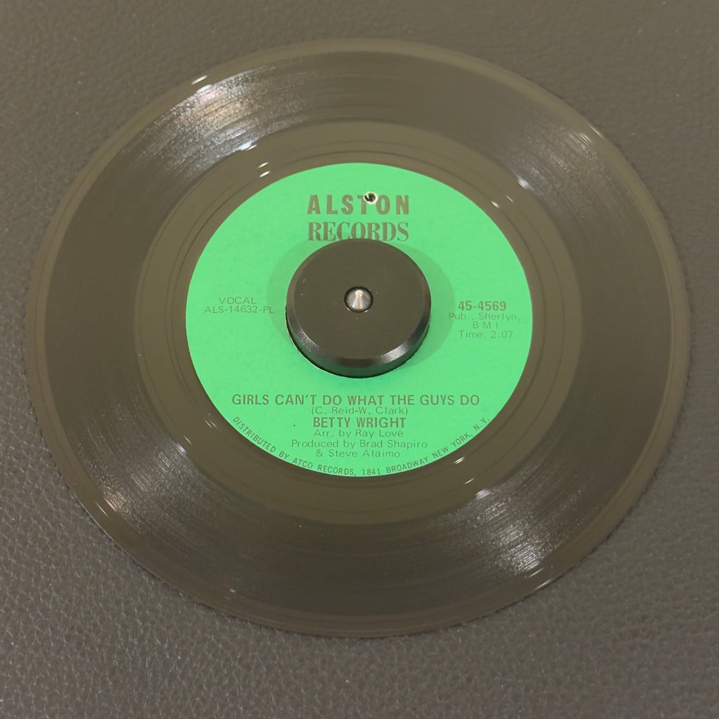 7" vinyl record by Betty Wright featuring "Girls Can't Do What The Guys Do/Sweet Lovin' Daddy", released on Alston Records (45-4569), in VG+ (Very Good Plus) condition, classic analog collectable for turntable playback. This original 1968 single featuring the legendary Miami soul anthem is an absolute cornerstone for R&B and classic soul collectors. Punch hole in label.