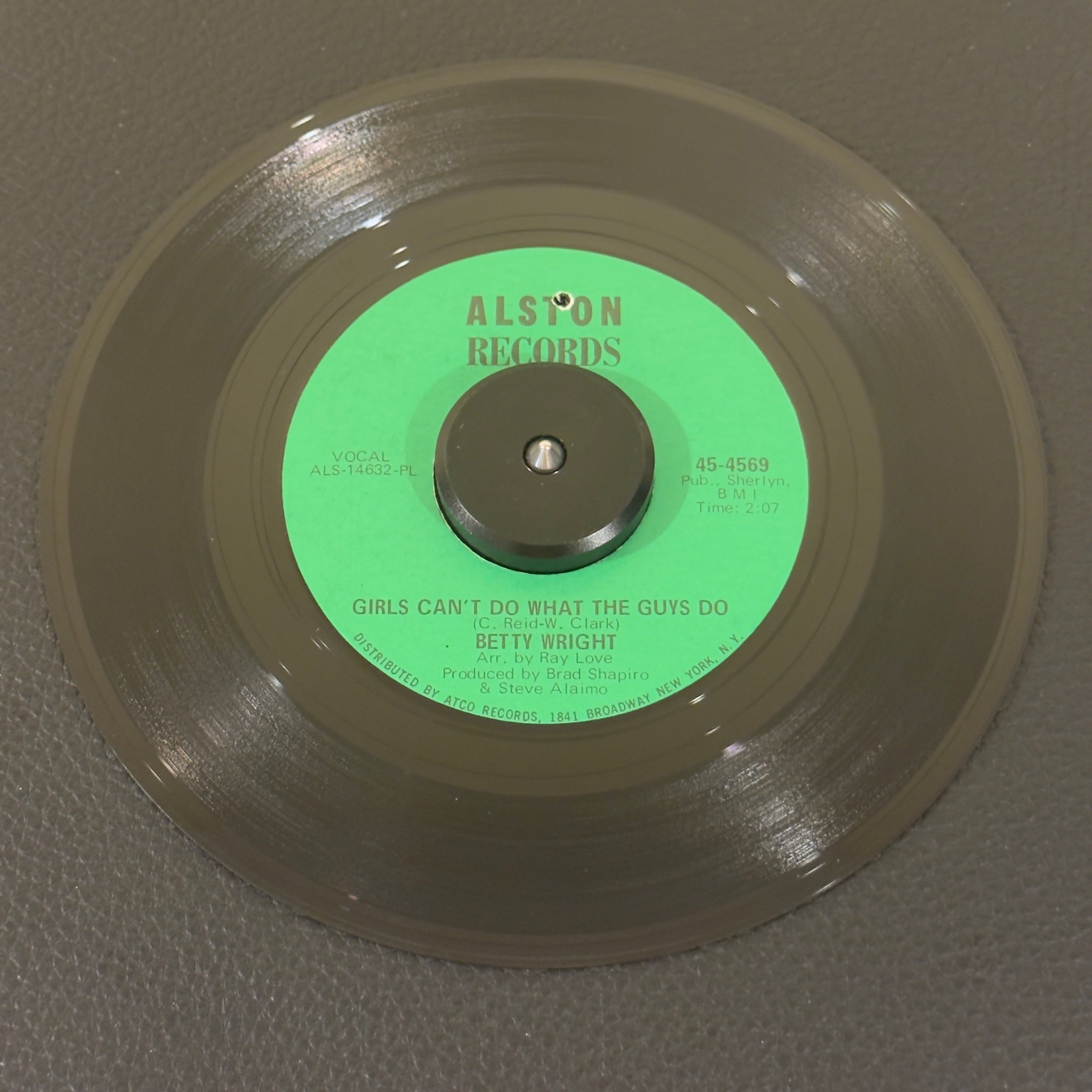 7" vinyl record by Betty Wright featuring "Girls Can't Do What The Guys Do/Sweet Lovin' Daddy", released on Alston Records (45-4569), in VG+ (Very Good Plus) condition, classic analog collectable for turntable playback. This original 1968 single featuring the legendary Miami soul anthem is an absolute cornerstone for R&B and classic soul collectors. Punch hole in label.