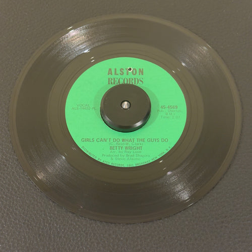 7" vinyl record by Betty Wright featuring "Girls Can't Do What The Guys Do/Sweet Lovin' Daddy", released on Alston Records (45-4569), in VG+ (Very Good Plus) condition, classic analog collectable for turntable playback. This original 1968 single featuring the legendary Miami soul anthem is an absolute cornerstone for R&B and classic soul collectors. Punch hole in label.