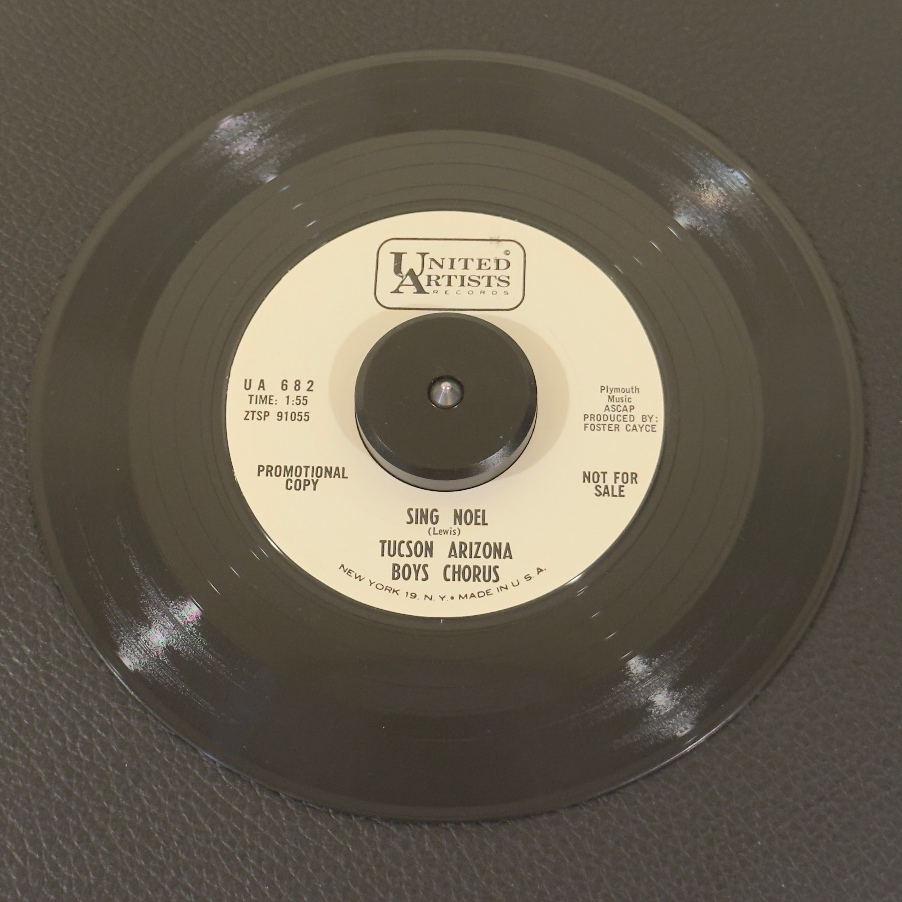7" vinyl record by Tucson Arizona Boys Chorus featuring "Sing Noel/Sleep Little Tiny King", released on United Artists Records (UA 682), in NM (Near Mint) condition, classic analog collectable for turntable playback. Vintage release features two magnificent seasonal performances directed during the group's mid-60s golden era. Perfect for choral collectors and holiday music enthusiasts.