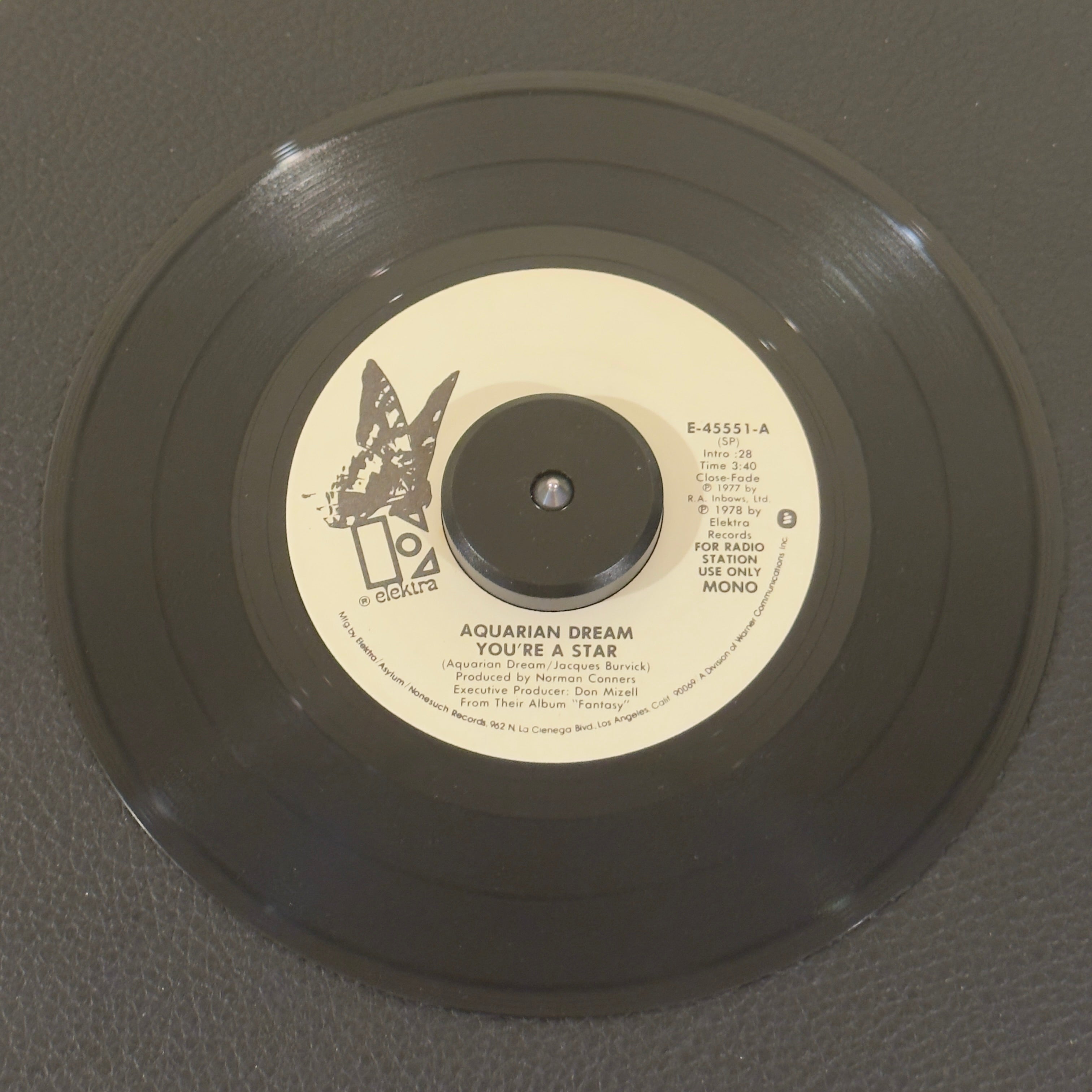 7" vinyl record by Aquarian Dream featuring "You're A Star/You're A Star", released on Elektra (E-45551), in VG+ (Very Good Plus) condition, classic analog collectable for turntable playback. Exceptional piece of 1978 underground dance history: an original produced by the legendary Norman Connors, this heavy jazz-funk / boogie crossover is an essential for club DJs and rare collectors.