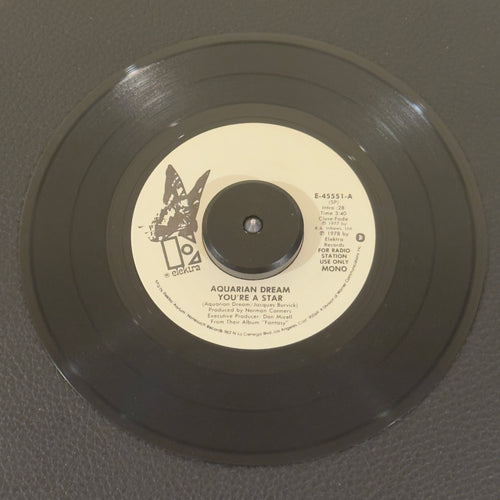 7" vinyl record by Aquarian Dream featuring "You're A Star/You're A Star", released on Elektra (E-45551), in VG+ (Very Good Plus) condition, classic analog collectable for turntable playback. Exceptional piece of 1978 underground dance history: an original produced by the legendary Norman Connors, this heavy jazz-funk / boogie crossover is an essential for club DJs and rare collectors.
