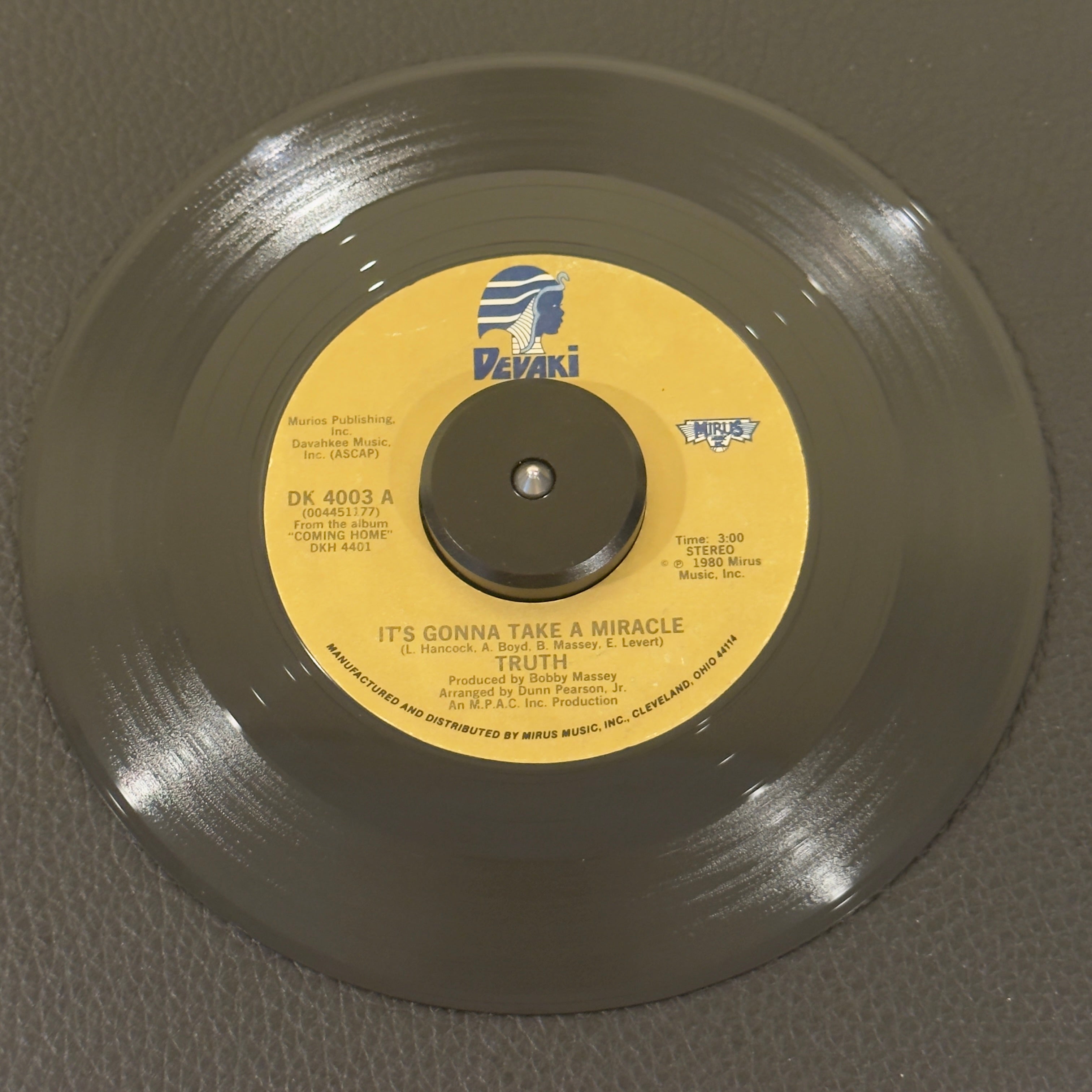 7" vinyl record by Truth featuring "It's Gonna Take A Miracle/International Dancing", released on Devaki Records (DK 4003), in VG (Very Good) condition, classic analog collectable for turntable playback. An essential addition for collectors of Ohio soul, lowrider oldies, or underground 80s dance 45s.