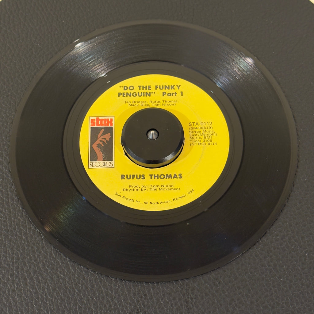 7" vinyl record by Rufus Thomas featuring "Do The Funky Penguin (Part 1)/Part 2", released on Stax (STA-0112), in VG (Very Good) condition, classic analog collectable for turntable playback. Highly collectible US Sonic Recording Products plant pressing of 1971 Memphis funk history! Original Stax sleeve included.