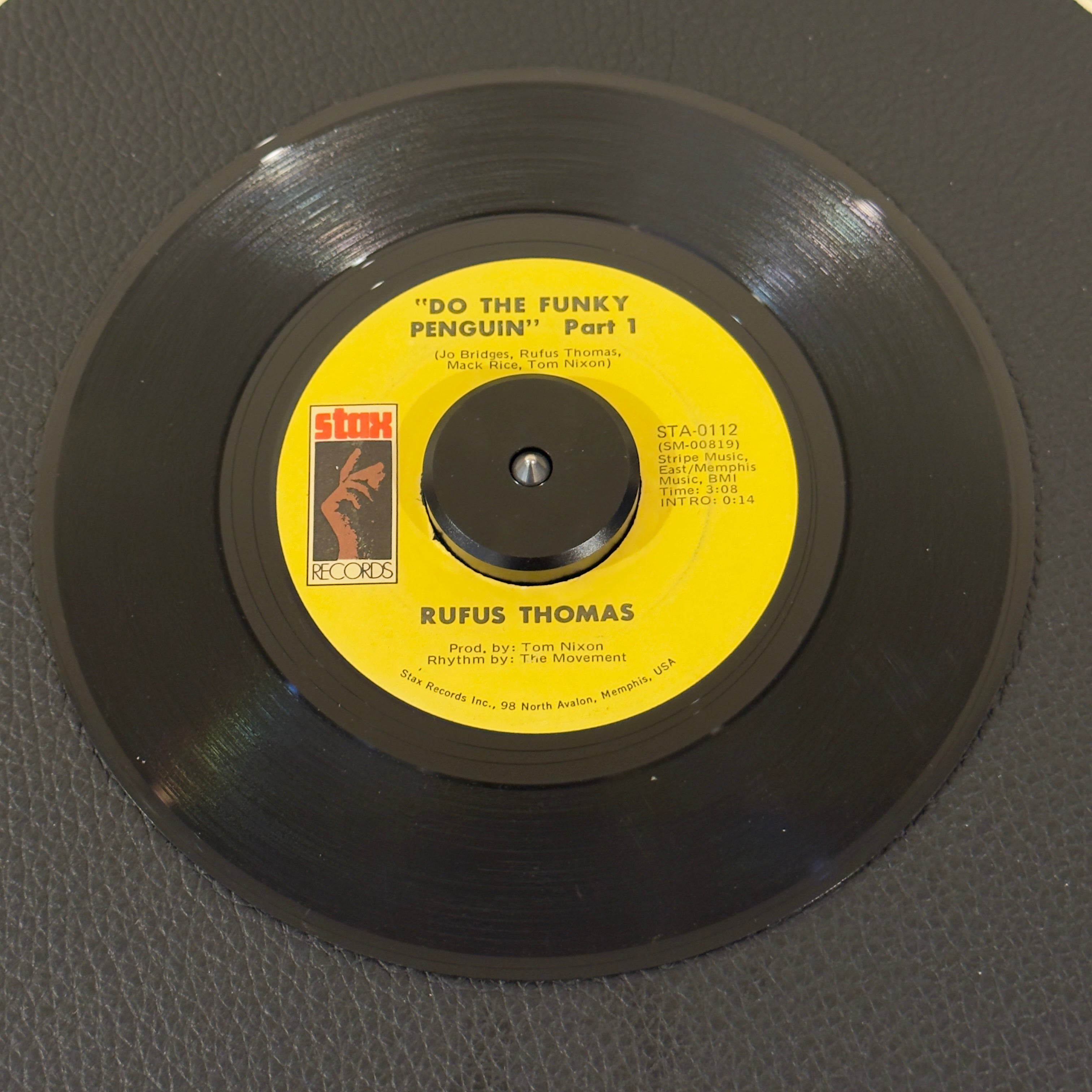 7" vinyl record by Rufus Thomas featuring "Do The Funky Penguin (Part 1)/Part 2", released on Stax (STA-0112), in VG (Very Good) condition, classic analog collectable for turntable playback. Highly collectible US Sonic Recording Products plant pressing of 1971 Memphis funk history! Original Stax sleeve included.