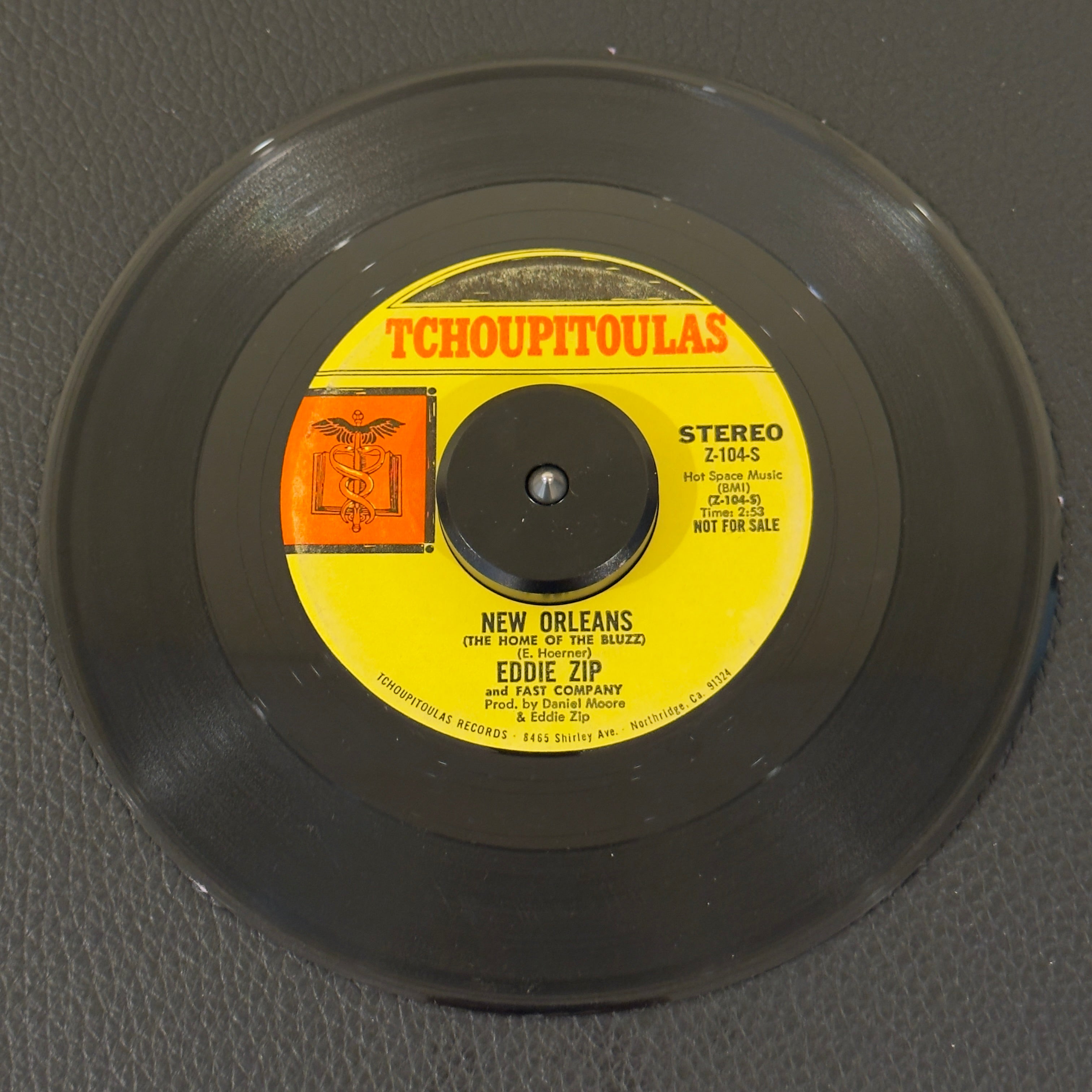 7" vinyl record by Eddie Zip and Fast Company featuring "New Orleans (Stereo)/(Mono)", released on Tchoupitoulas (Z-104-S / Z-103-M), in VG (Very Good) condition, classic analog collectable for turntable playback. An absolute ghost of a New Orleans record. This is a promotional copy of the privately pressed regional masterpiece and a top-tier centerpiece acquisition for serious collectors.