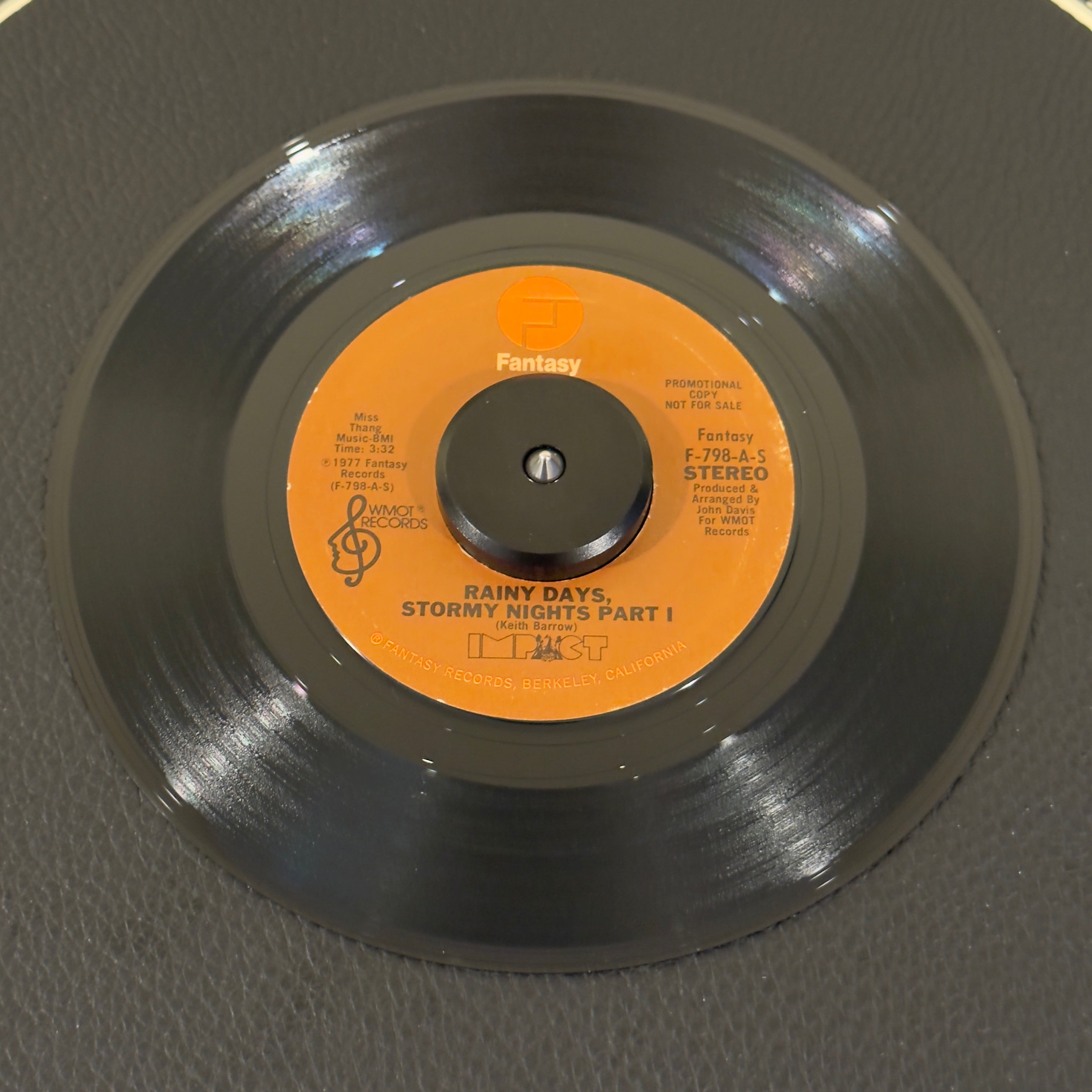 7" vinyl record by Impact featuring "Rainy Days, Stormy Nights Part I/Rainy Days, Stormy Nights Part I", released on Fantasy (F 798-A-S / F 798-A-M), in NM (Near Mint) condition, classic analog collectable for turntable playback. Promo copy of this 1977 Philly Soul vinyl.