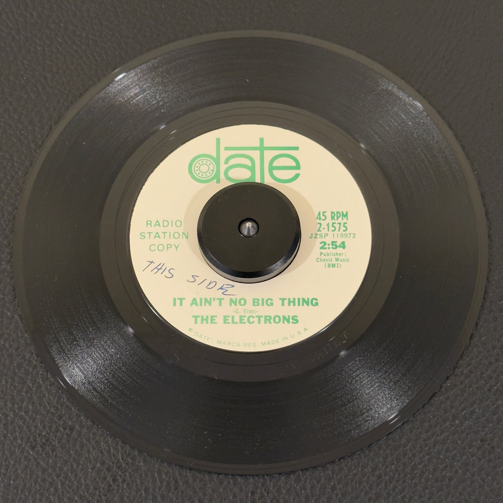 7" vinyl record by Electrons, The featuring "It Ain't No Big Thing/In The Midnight Hour", released on Date (2-1575), in VG+ (Very Good Plus) condition, classic analog collectable for turntable playback. An exceptional slice of 1967 sweet and Northern Soul history, this promo copy remains a coveted spin for rare-soul DJs and crossover collectors worldwide. Original Date sleeve included.