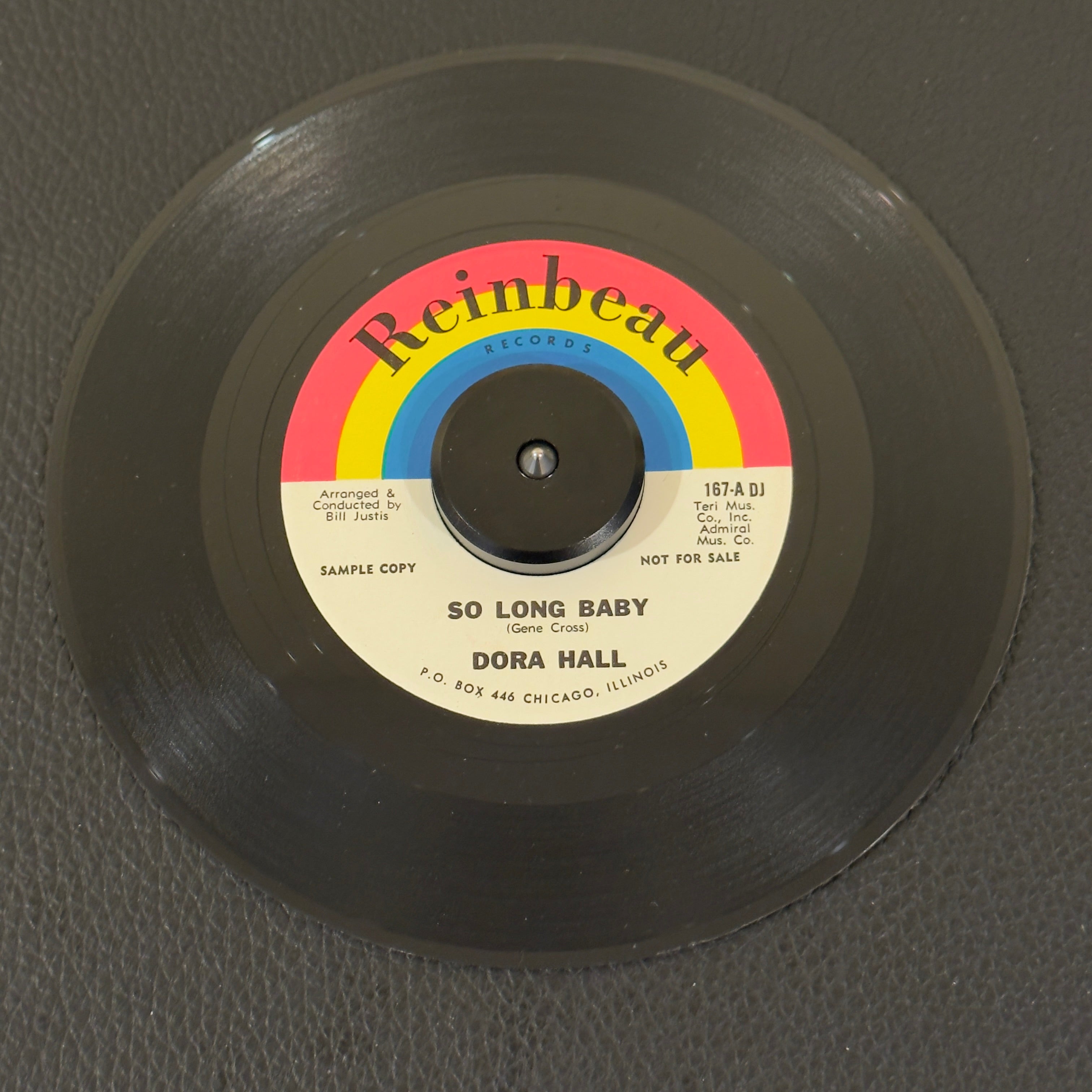 7" vinyl record by Dora Hall featuring "So Long Baby/Flowers On The Wall", released on Reinbeau Records (810P-5820 DJ), in NM (Near Mint) condition, classic analog collectable for turntable playback. Own one of the most bizarre records in music history! Hall was married to Leo Hulseman, the owner of the Solo Cup Company. Her records were included as promos in boxes of Solo Cozy Cups.