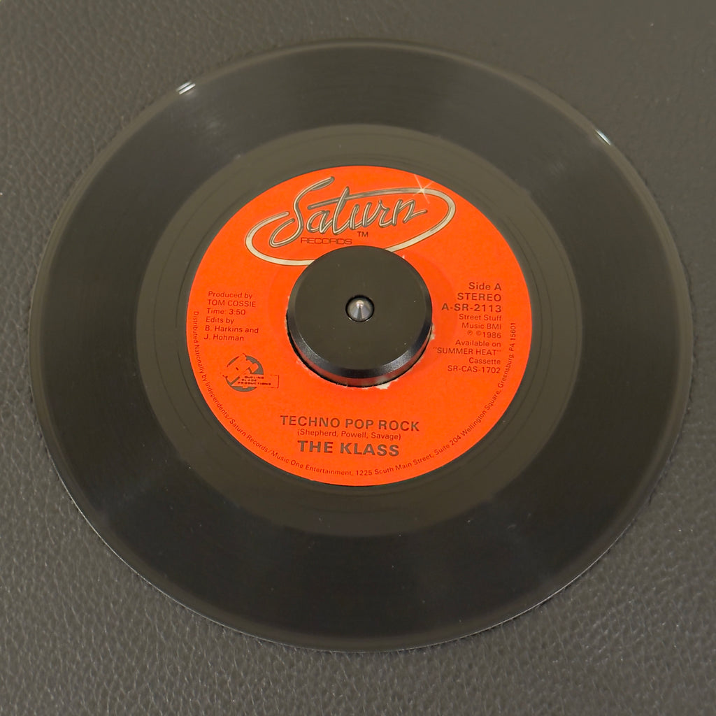 7" vinyl record by Klass, The featuring "Techno Pop Rock/Now That I Have You", released on Saturn Records (SR-2113), in VG+ (Very Good Plus) condition, classic analog collectable for turntable playback. Blistering slice of 1986 electro-funk and proto-techno.